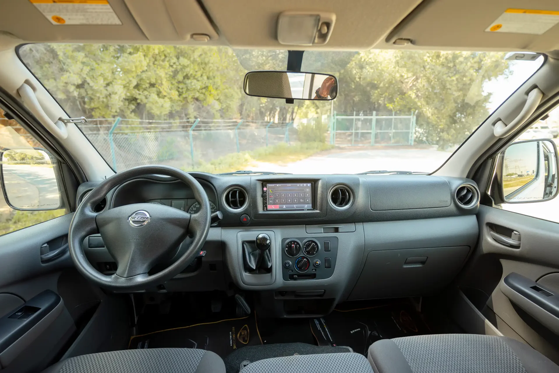 Used 2022 Nissan Urvan Standard Roof in White – Front Cabin / Dashboard Full View for Sale at First Choice Cars Dubai Sharjah