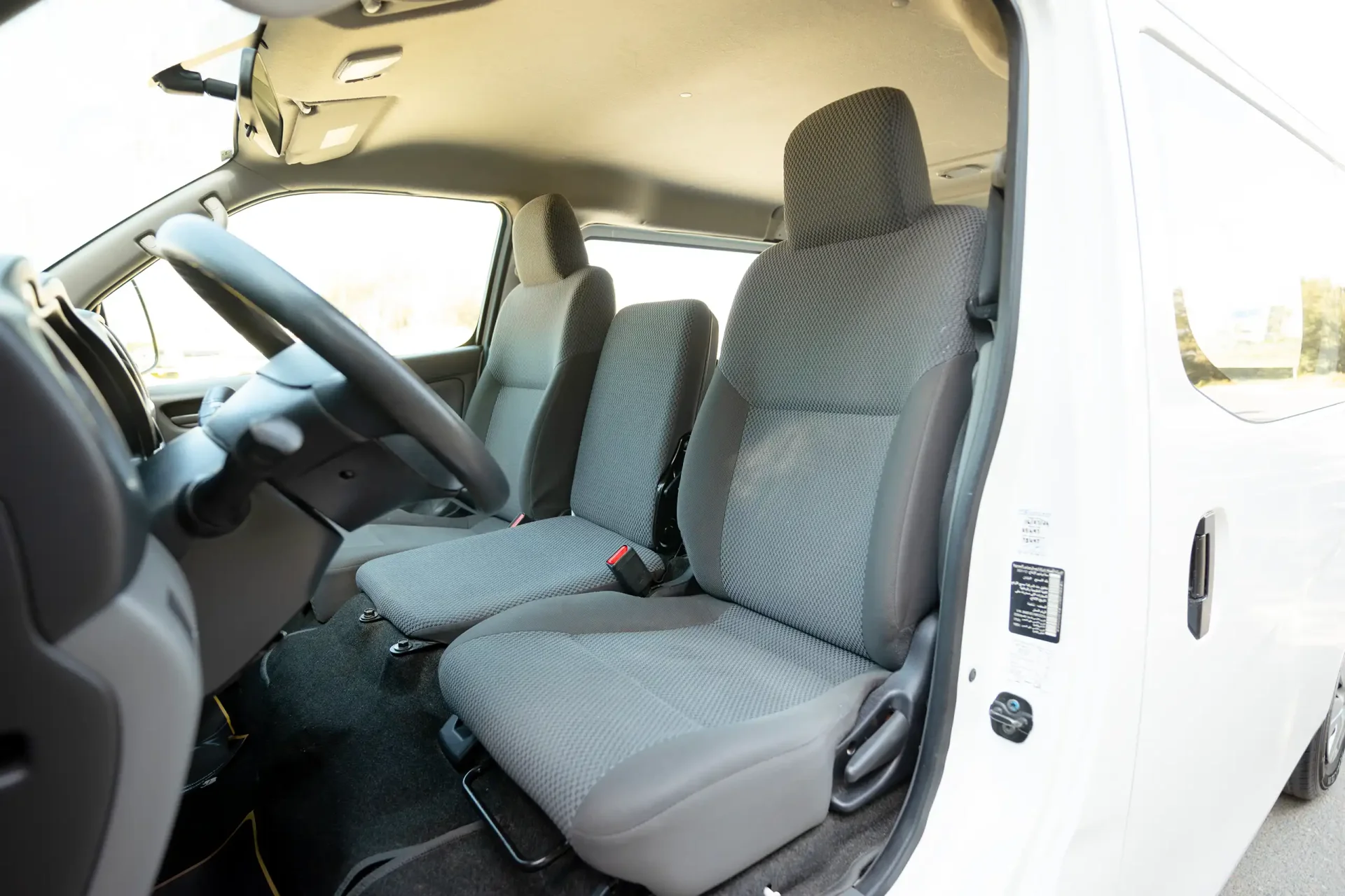 Used 2022 Nissan Urvan Standard Roof in White – Front Driver Side Cabin View for Sale at First Choice Cars Dubai Sharjah