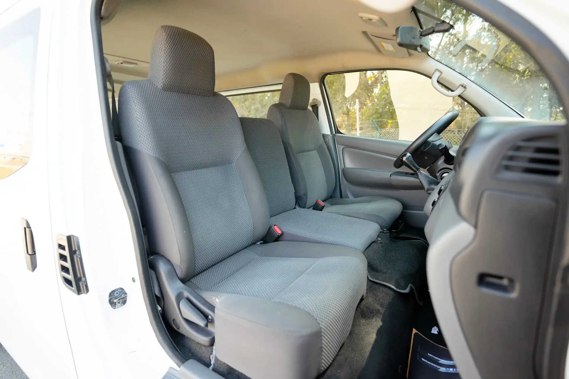 Used 2022 Nissan Urvan Standard Roof in White – Front Passenger Side Cabin View for Sale at First Choice Cars Dubai Sharjah