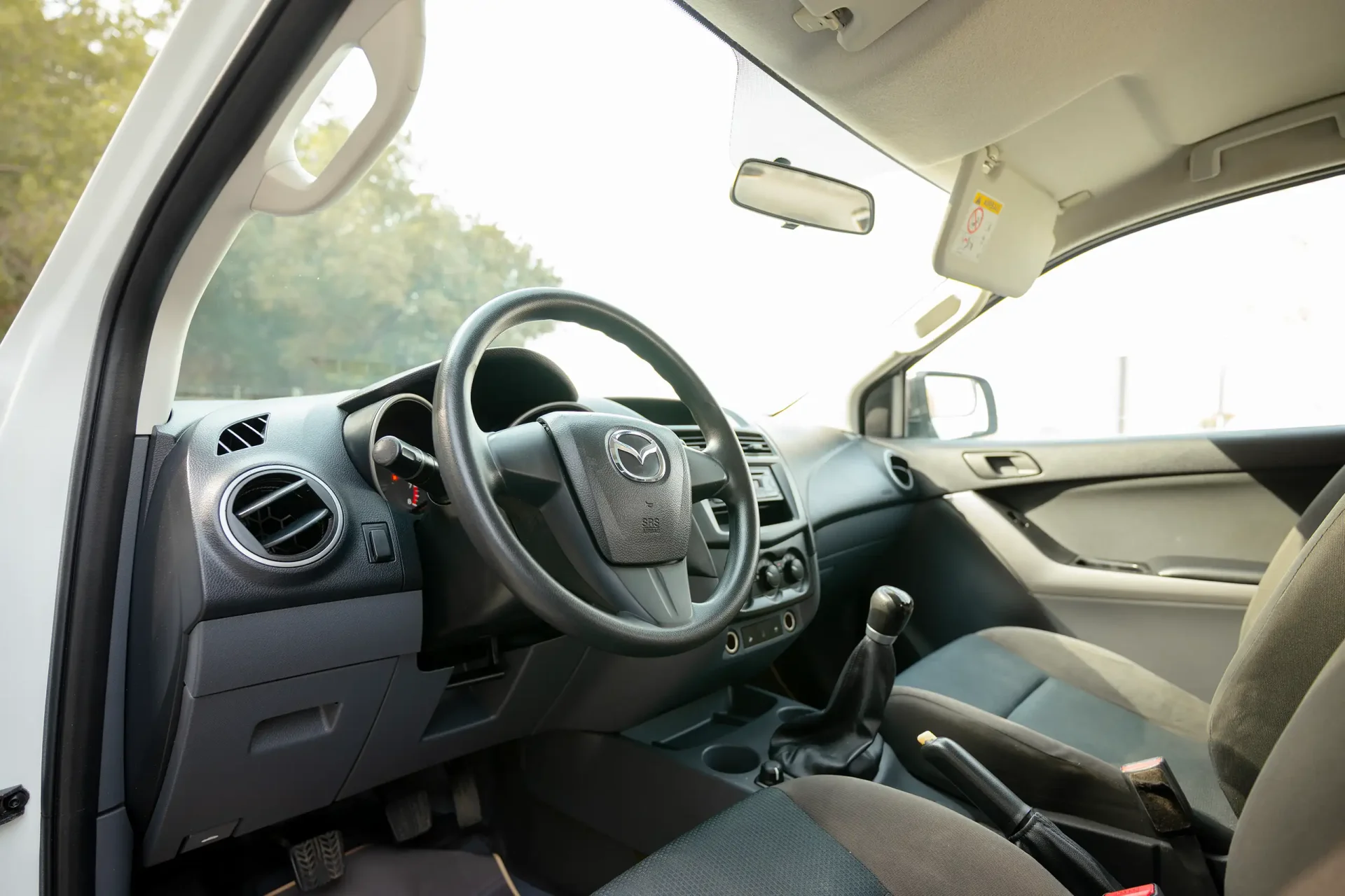 Used 2020 Mazda BT-50 XS in White – Driver Side Dashboard & Steering View for Sale at First Choice Cars Dubai Sharjah