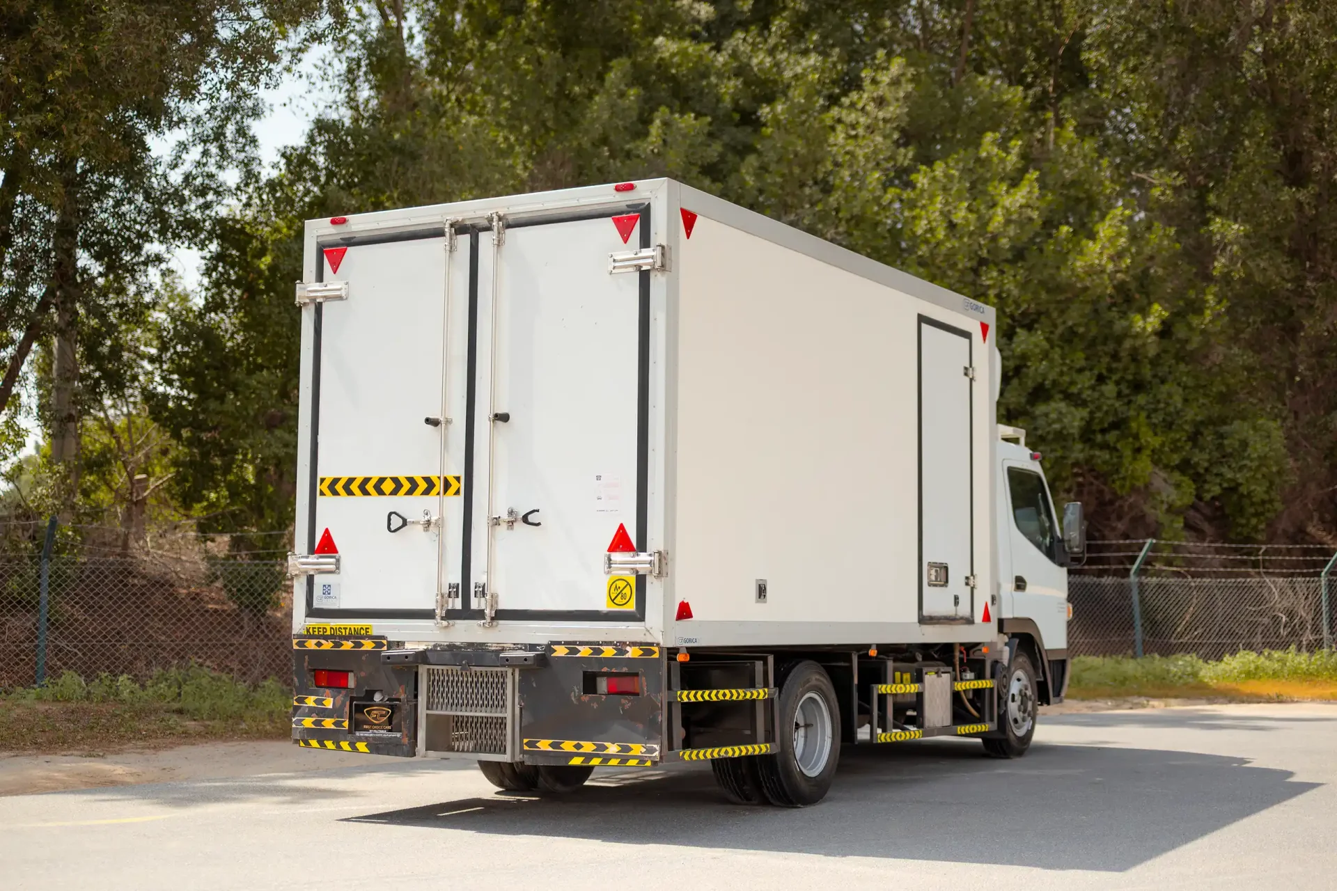 Used 2020 Mitsubishi Canter Freezer Box in White – Right Back Diagonal (45°) View for Sale at First Choice Cars Dubai Sharjah