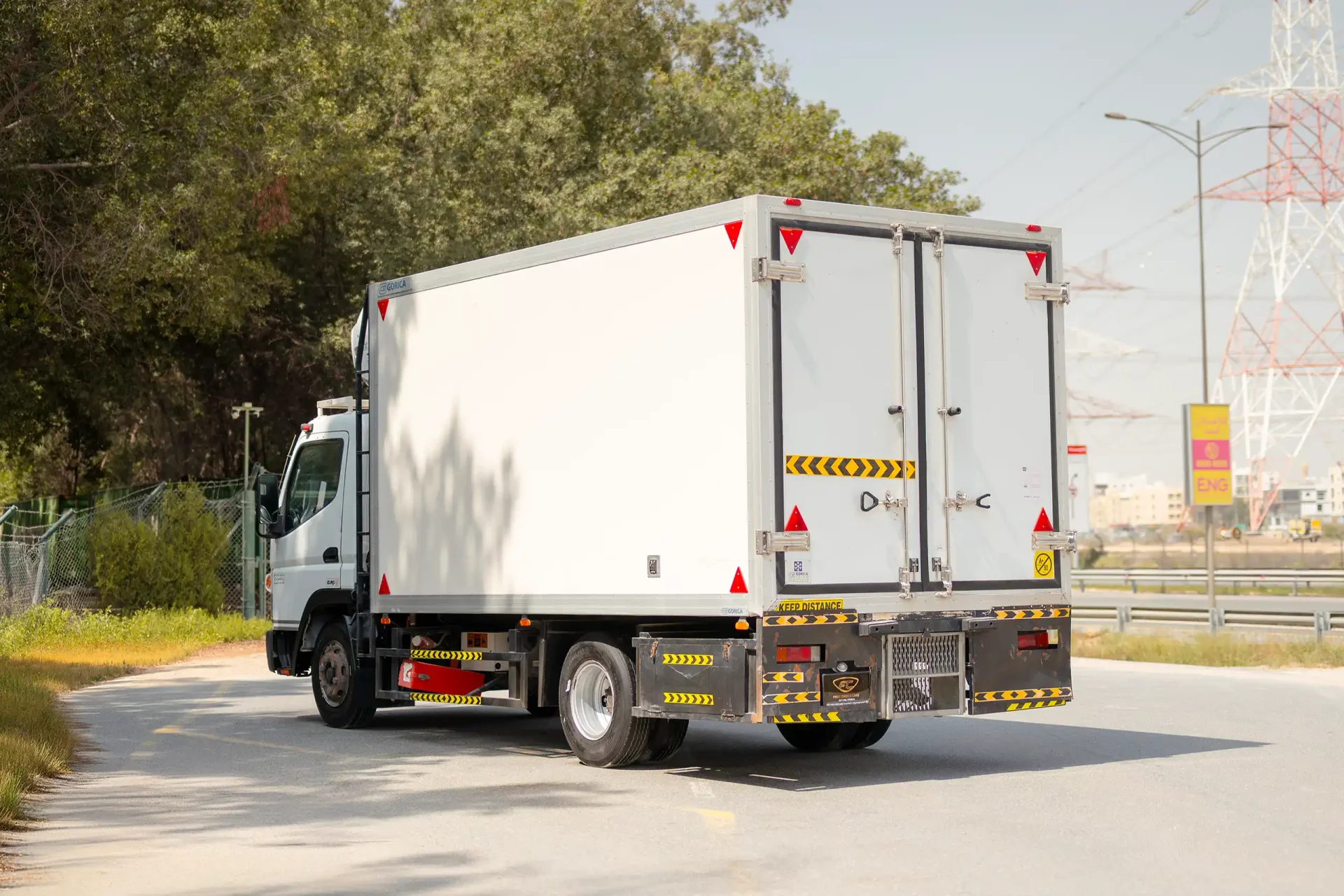 Used 2020 Mitsubishi Canter Freezer Box in White – Left Back Diagonal (45°) View for Sale at First Choice Cars Dubai Sharjah