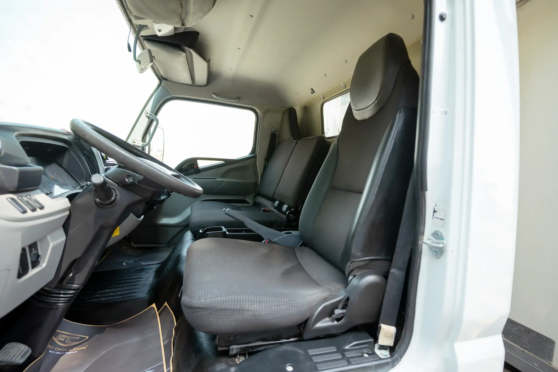 Used 2020 Mitsubishi Canter Freezer Box in White – Front Driver Side Cabin View for Sale at First Choice Cars Dubai Sharjah
