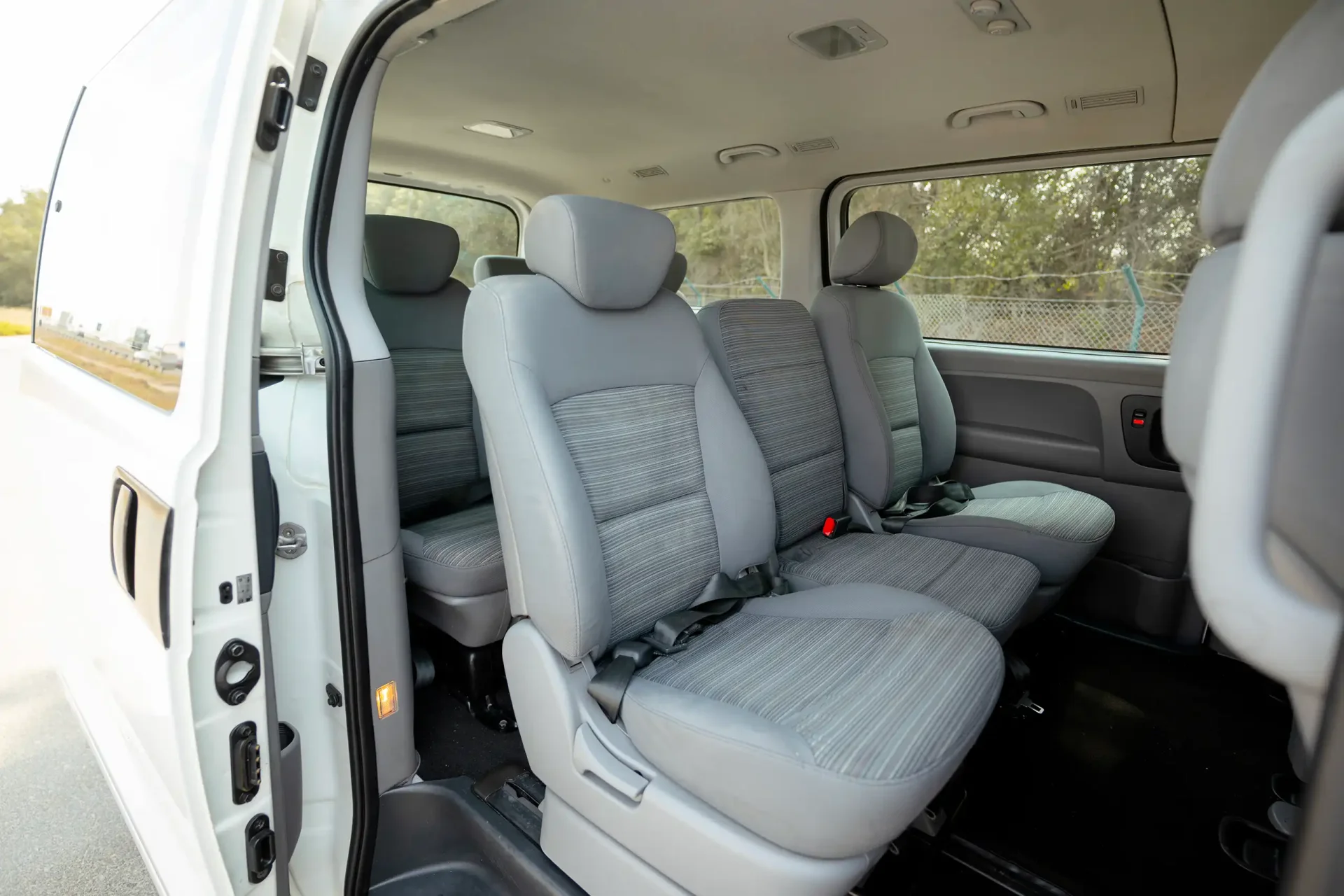 Used 2021 Hyundai H1 12-Seater Wagon in White – Rear Passenger Side Cabin View for Sale at First Choice Cars Dubai Sharjah