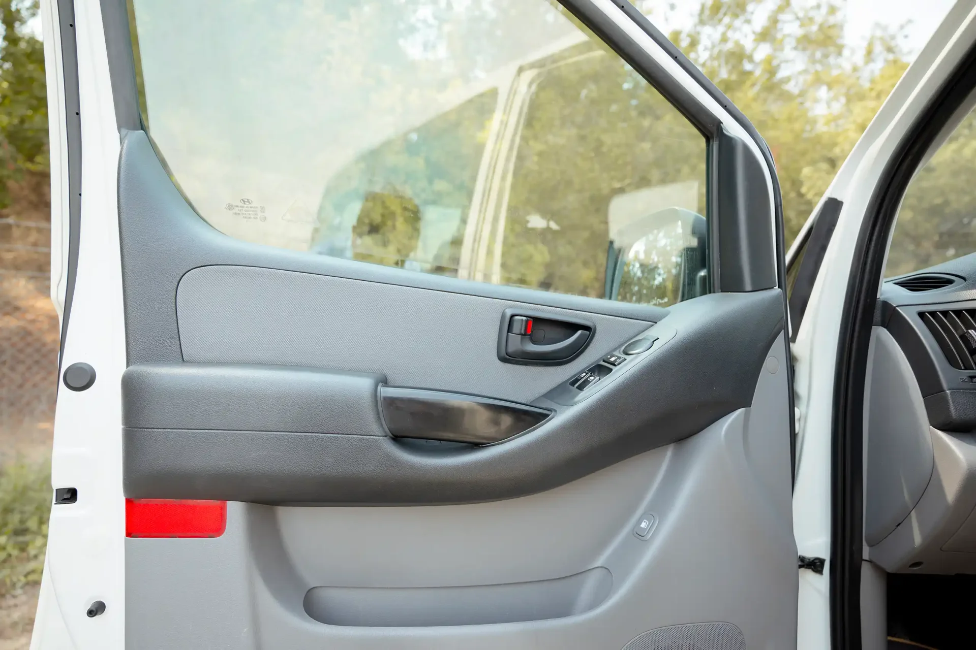 Used 2021 Hyundai H1 12-Seater Wagon in White – Driver Door Panel Full View for Sale at First Choice Cars Dubai Sharjah