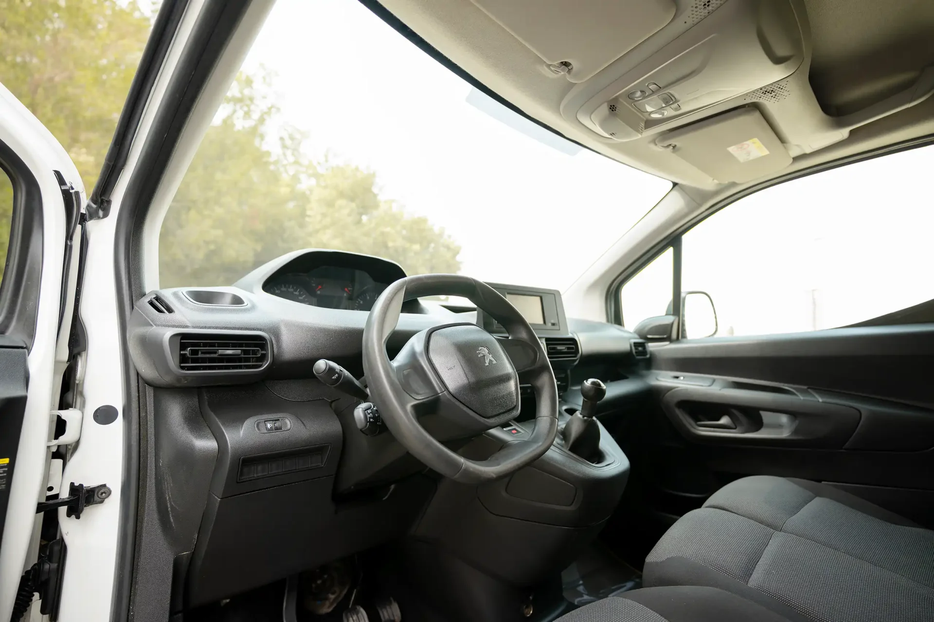Used 2022 Peugeot Partner Standard in White – Driver Side Dashboard & Steering View for Sale at First Choice Cars Dubai Sharjah