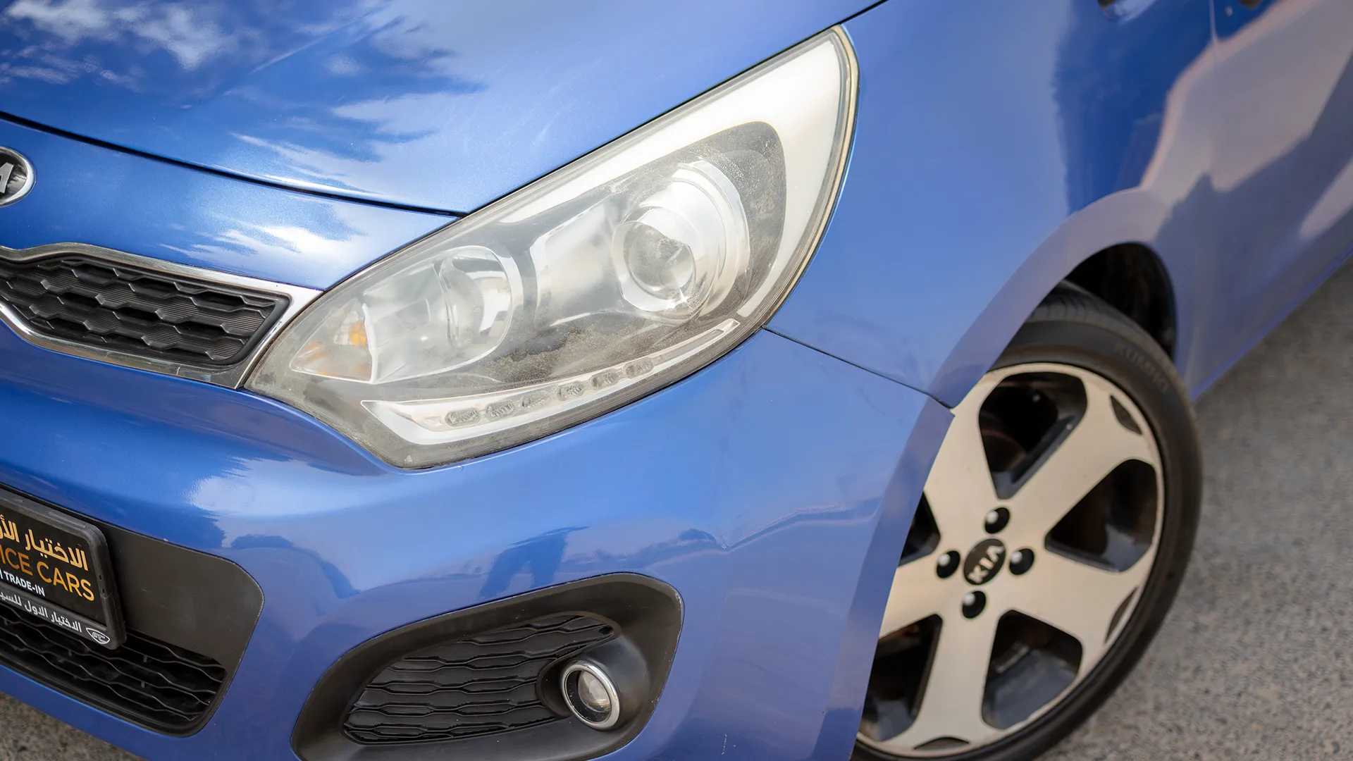 Used 2015 Kia Rio EX in Blue – Headlight Close-up for Sale at First Choice Cars Dubai Sharjah