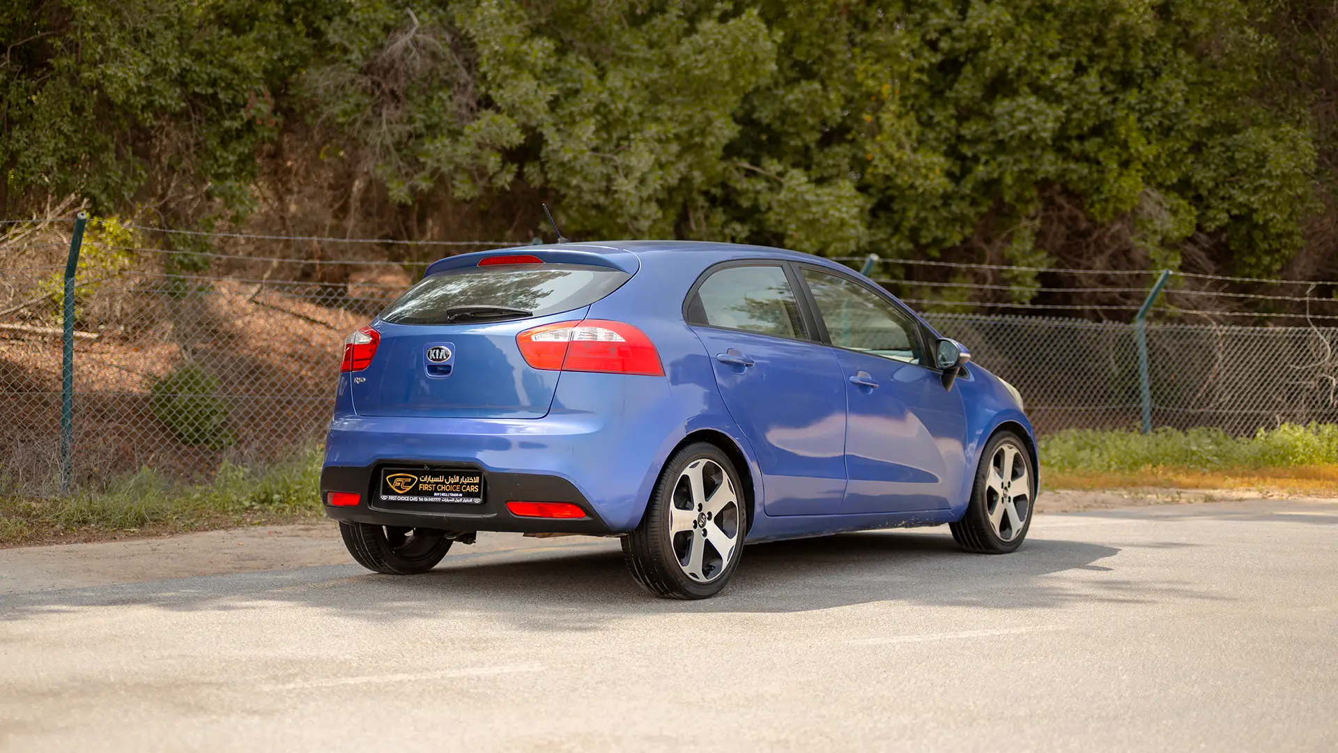 Used 2015 Kia Rio EX in Blue – Right Back Diagonal (45°) View for Sale at First Choice Cars Dubai Sharjah