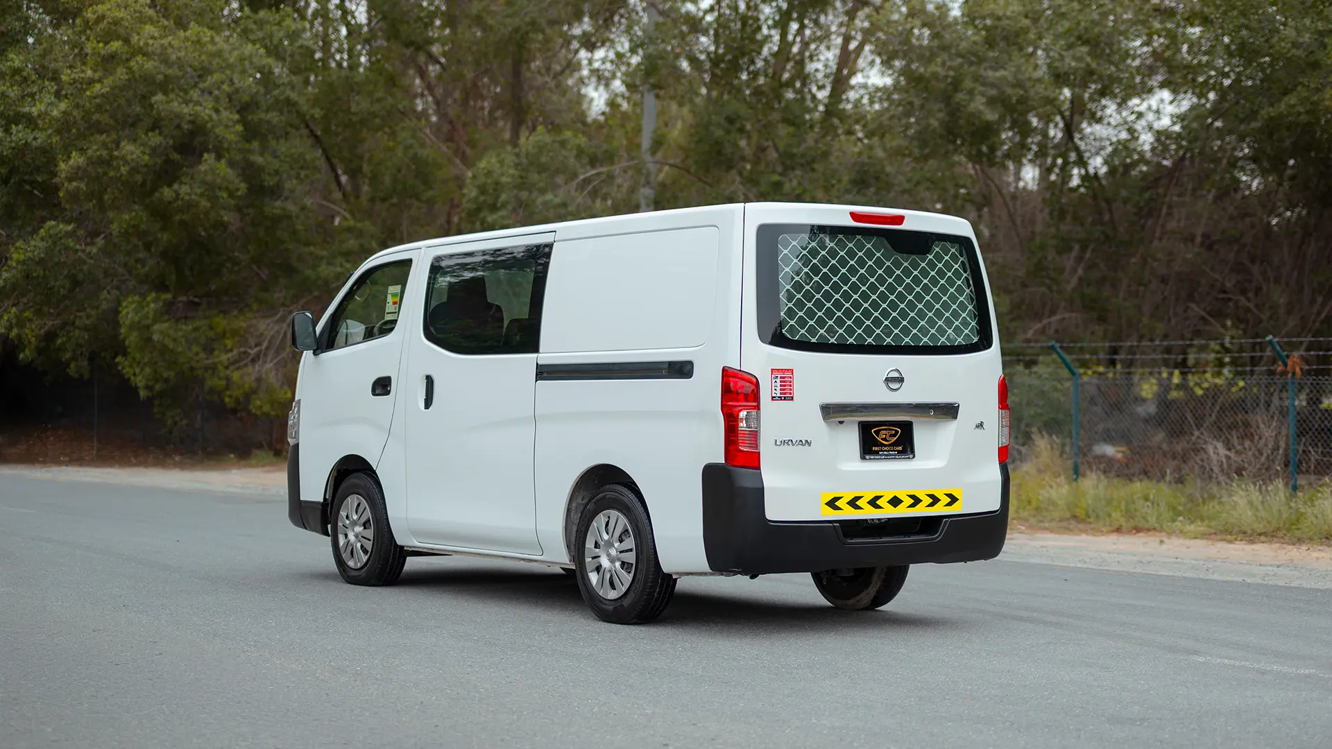 Used 2022 Nissan Urvan Standard Roof in White – Left Back Diagonal (45°) View for Sale at First Choice Cars Dubai Sharjah
