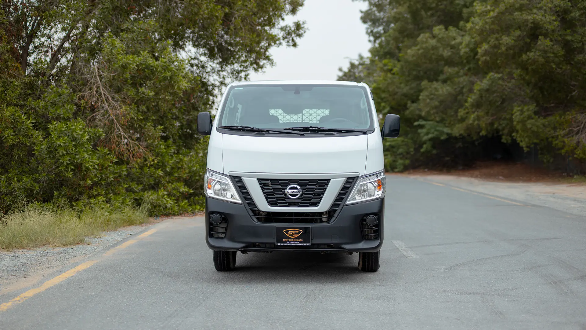 Used 2022 Nissan Urvan Standard Roof in White – Front View for Sale at First Choice Cars Dubai Sharjah