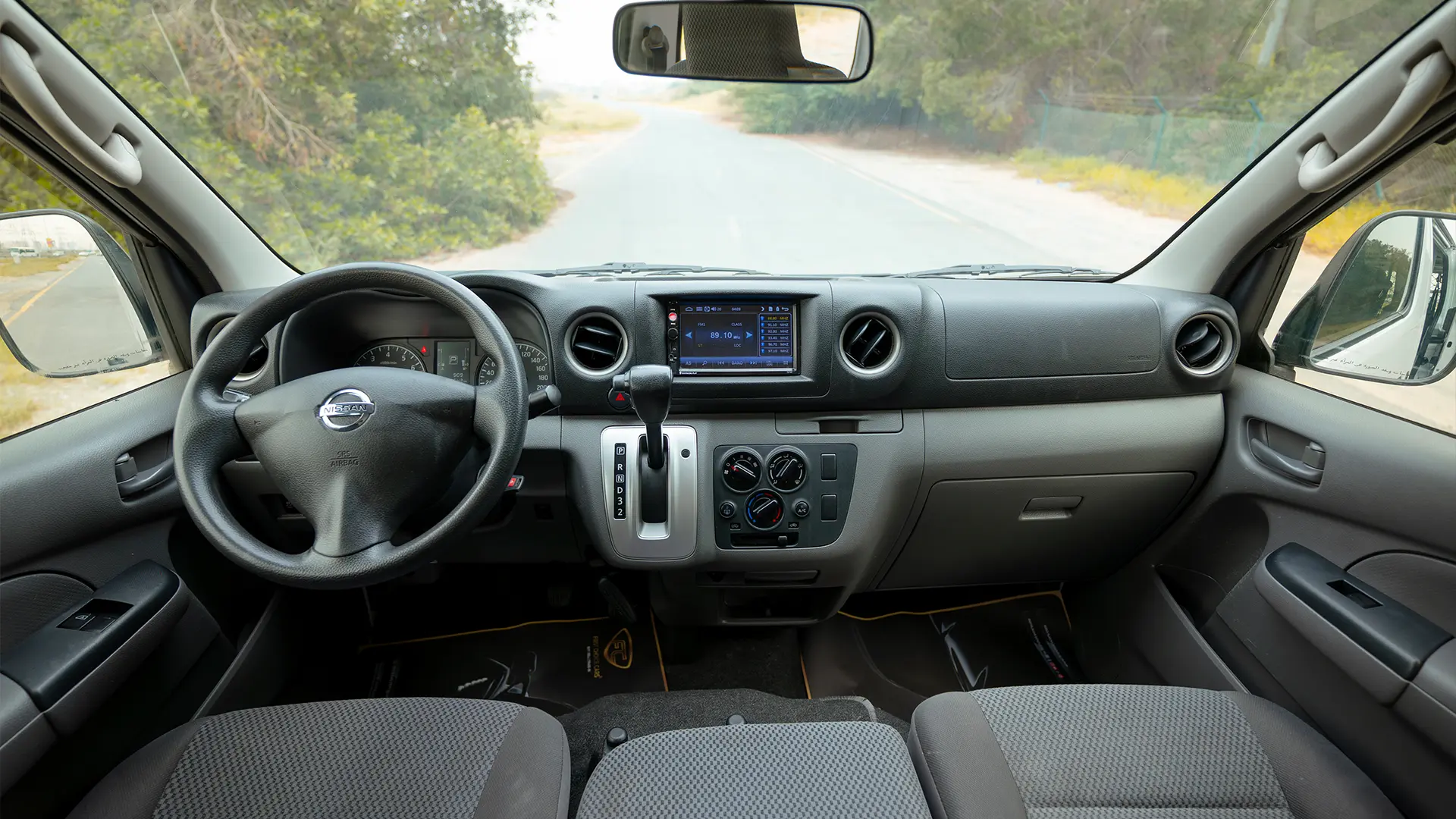 Used 2022 Nissan Urvan Standard Roof in White – Front Cabin / Dashboard Full View for Sale at First Choice Cars Dubai Sharjah