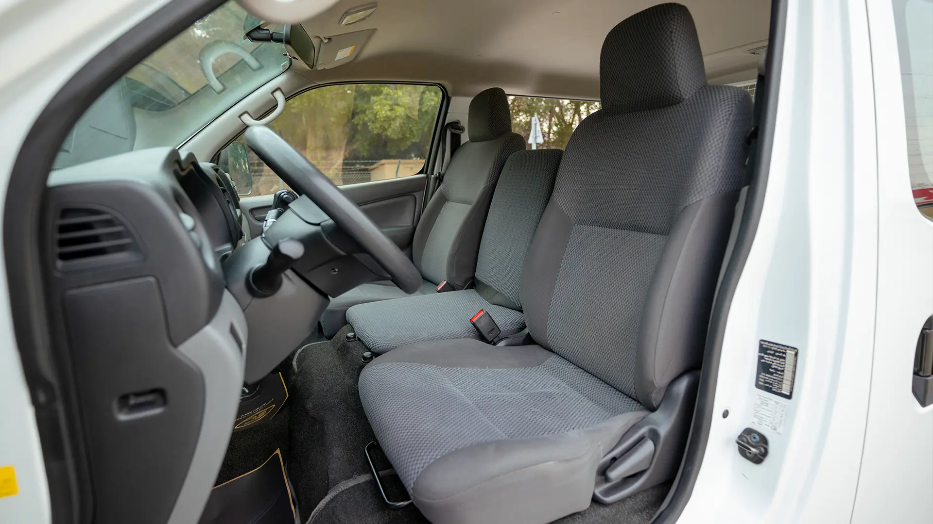 Used 2022 Nissan Urvan Standard Roof in White – Front Driver Side Cabin View for Sale at First Choice Cars Dubai Sharjah