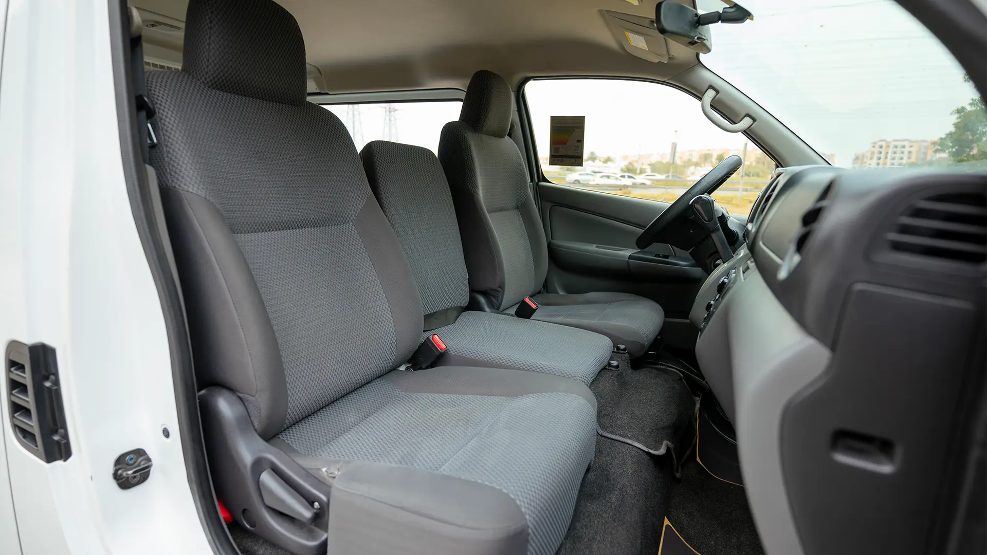 Used 2022 Nissan Urvan Standard Roof in White – Front Passenger Side Cabin View for Sale at First Choice Cars Dubai Sharjah