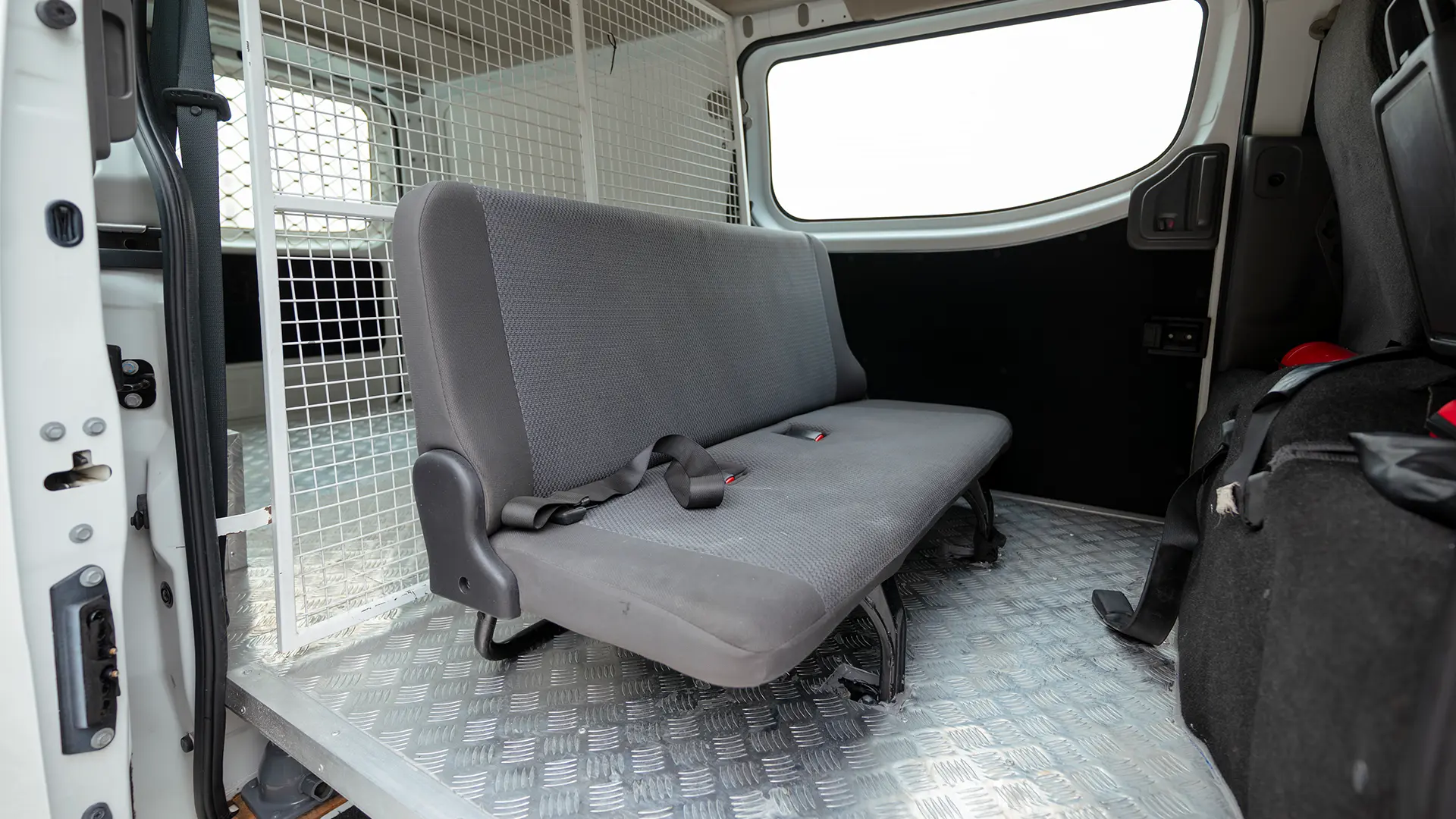 Used 2022 Nissan Urvan Standard Roof in White – Rear Passenger Side Cabin View for Sale at First Choice Cars Dubai Sharjah