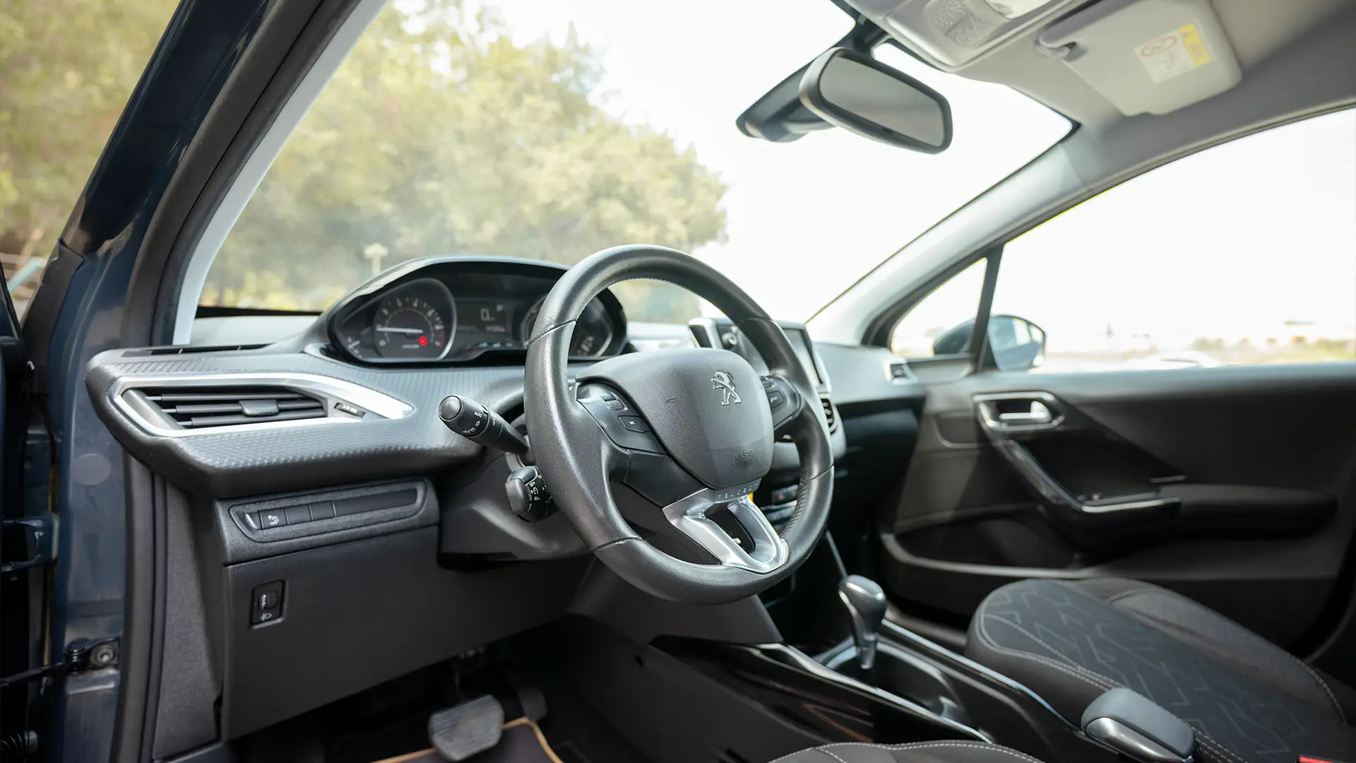 Used 2020 Peugeot 2008 Active in Black – Driver Side Dashboard & Steering View for Sale at First Choice Cars Dubai Sharjah