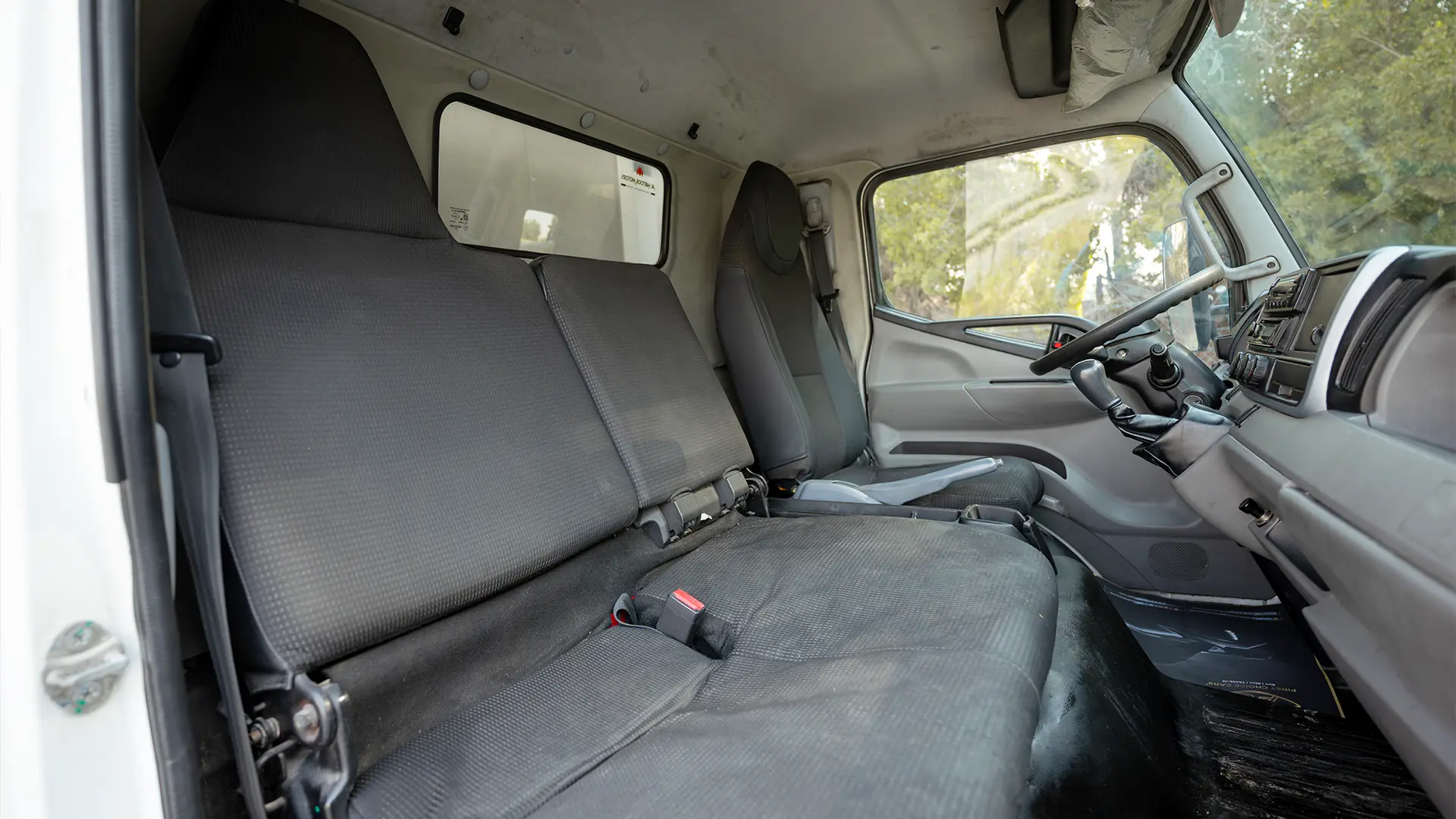 Used 2020 Mitsubishi Canter Chiller Box in White – Front Passenger Side Cabin View for Sale at First Choice Cars Dubai Sharjah