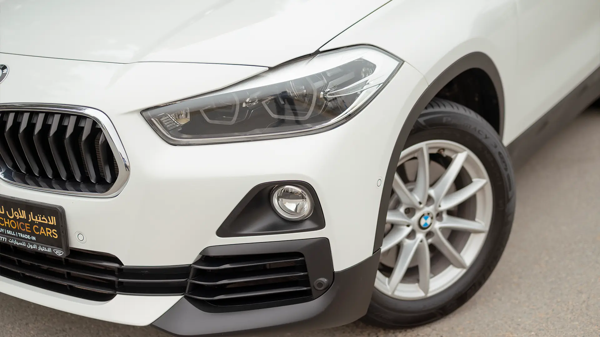 Used 2020 BMW X2 S-Drive 20i in White – Headlight Close-up for Sale at First Choice Cars Dubai Sharjah