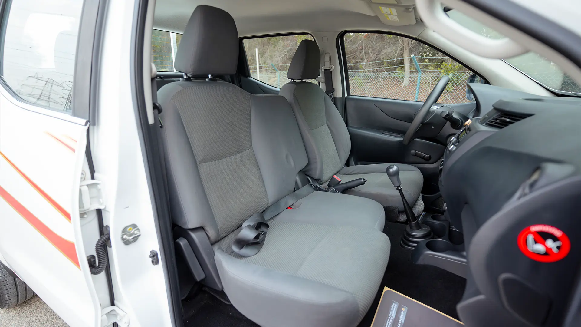 Used 2022 Nissan Navara SE in White – Front Passenger Side Cabin View for Sale at First Choice Cars Dubai Sharjah