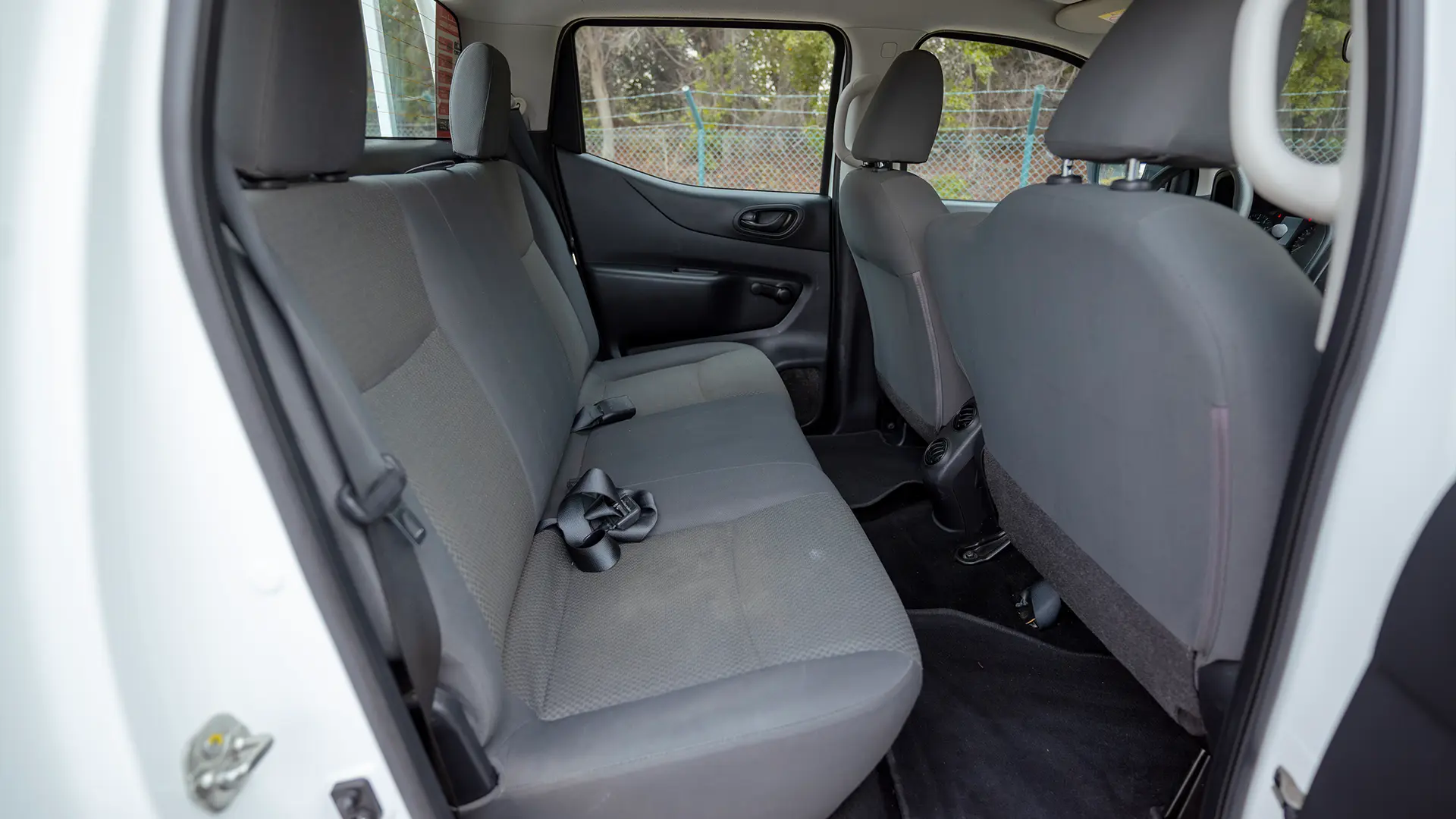 Used 2022 Nissan Navara SE in White – Rear Passenger Side Cabin View for Sale at First Choice Cars Dubai Sharjah