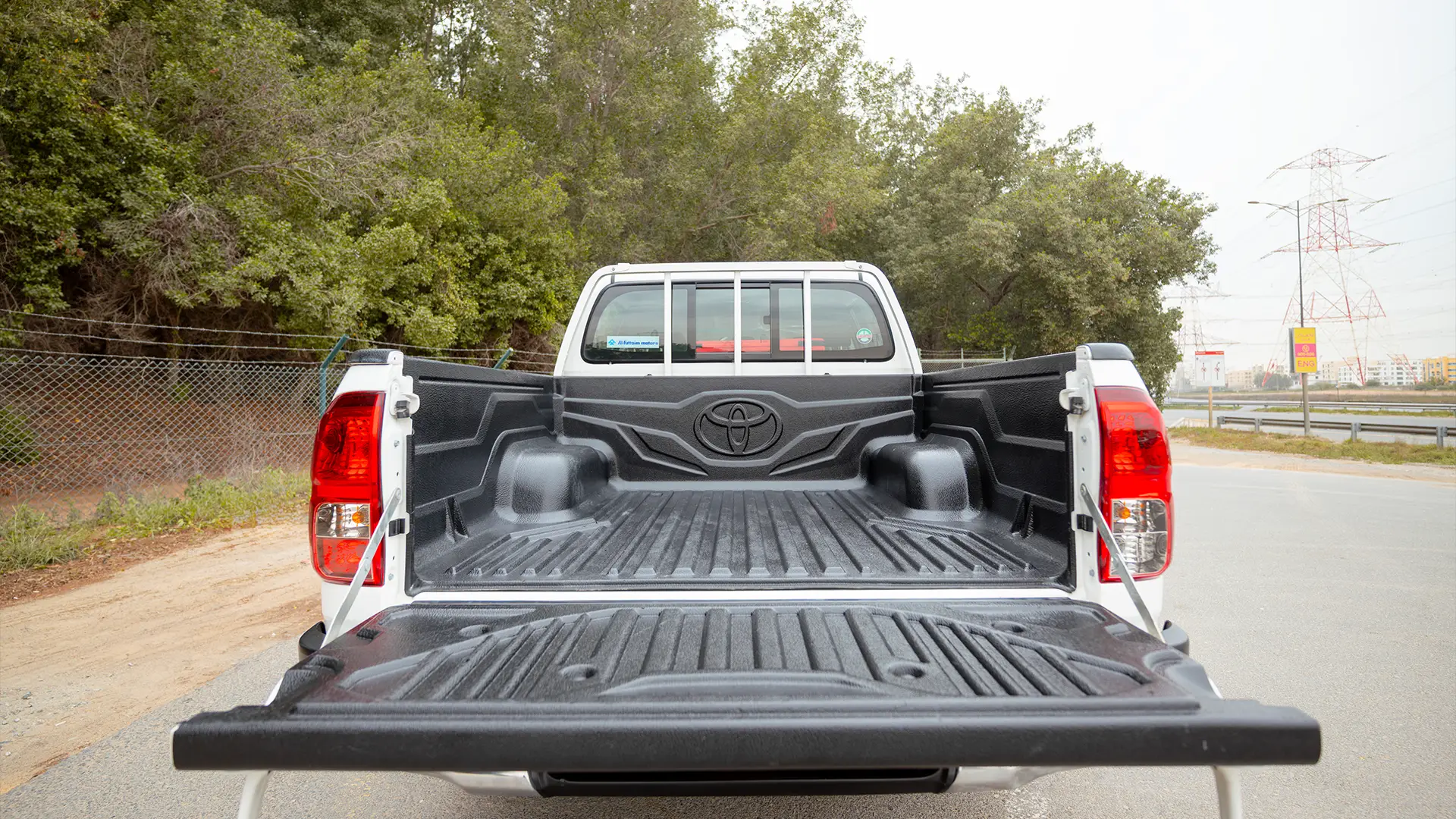 Used 2024 Toyota Hilux GL Double Cabin in White – Boot / Trunk Space Open View for Sale at First Choice Cars Dubai Sharjah