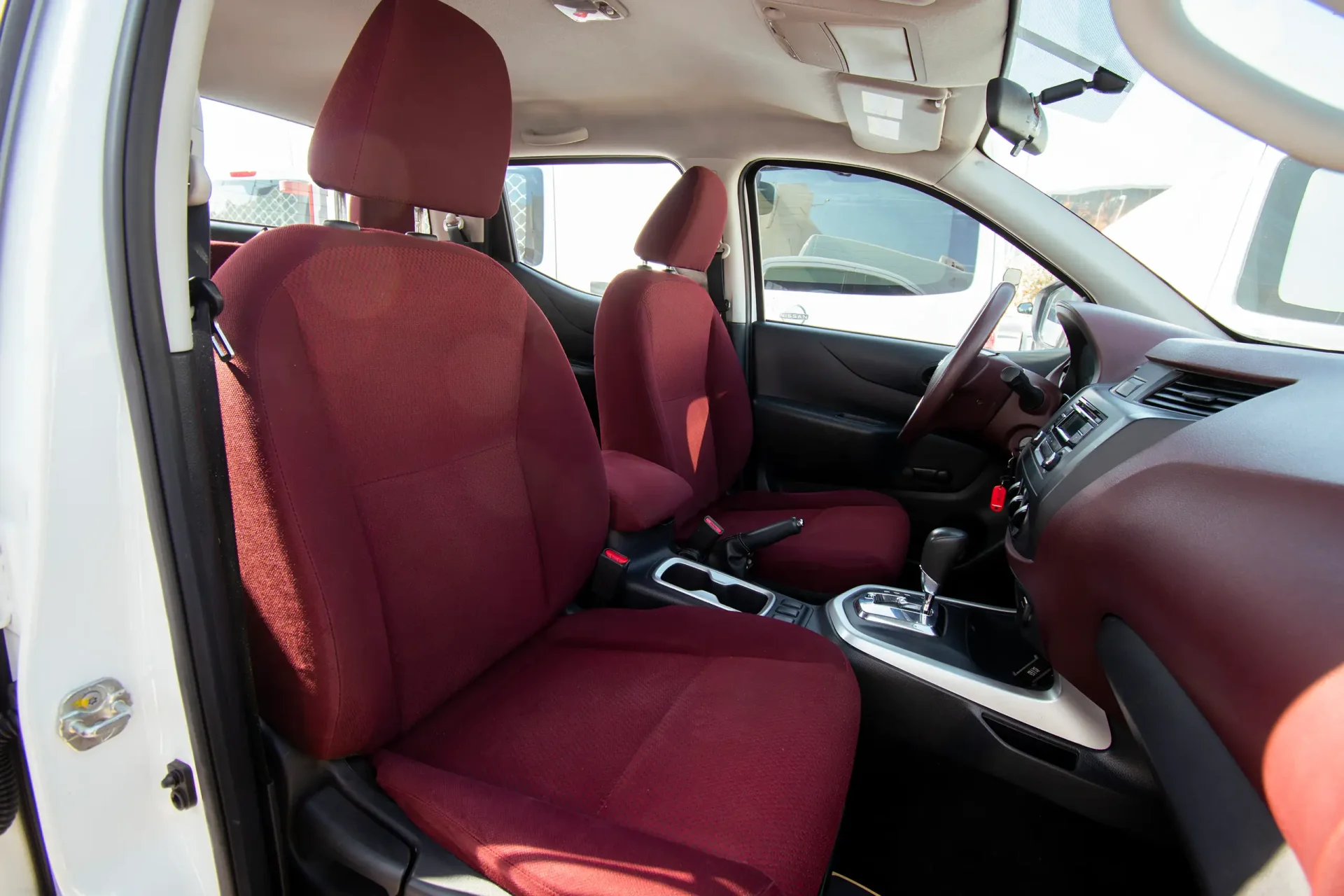 Used 2022 Nissan Navara SE in White – Front Passenger Side Cabin View for Sale at First Choice Cars Dubai Sharjah