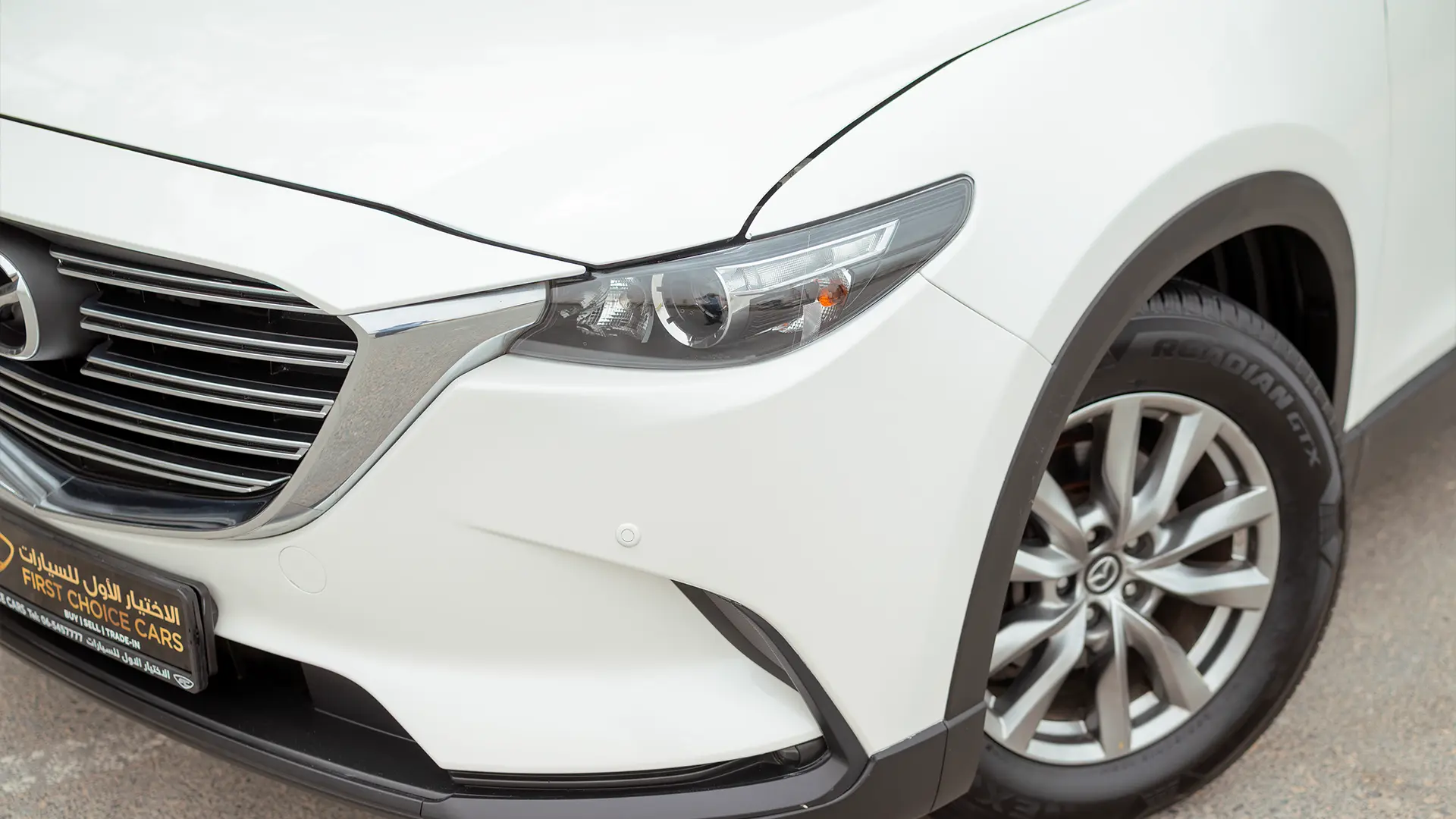 Used 2020 Mazda CX-9 GT in White – Headlight Close-up for Sale at First Choice Cars Dubai Sharjah