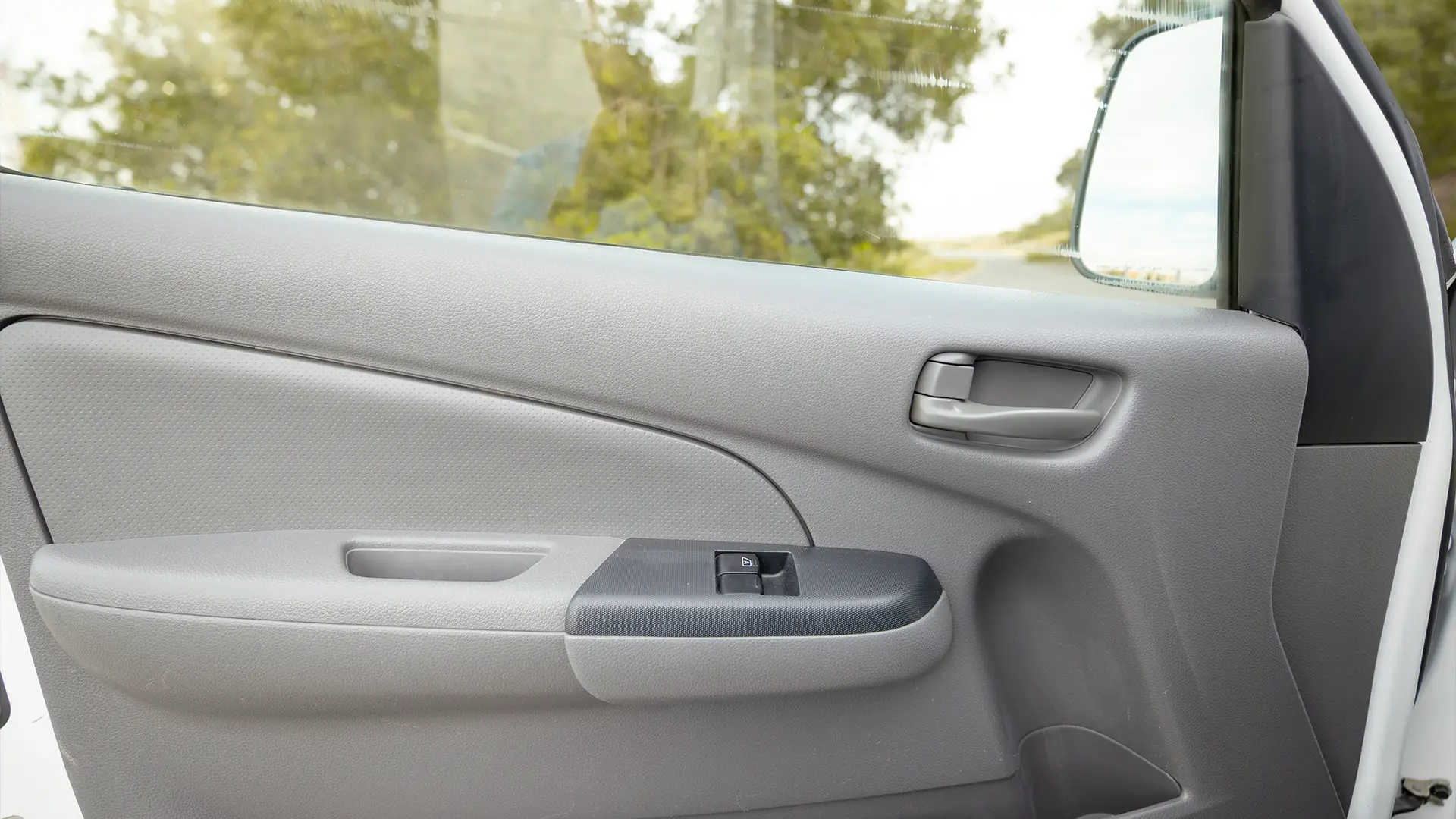Used 2022 Nissan Urvan High Roof in White – Driver Door Panel Full View for Sale at First Choice Cars Dubai Sharjah