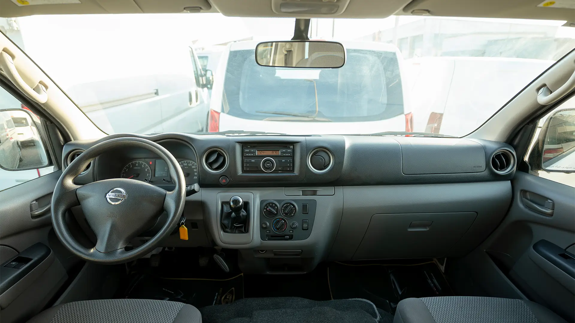 Used 2019 Nissan Urvan High Roof in White – Front Cabin / Dashboard Full View for Sale at First Choice Cars Dubai Sharjah