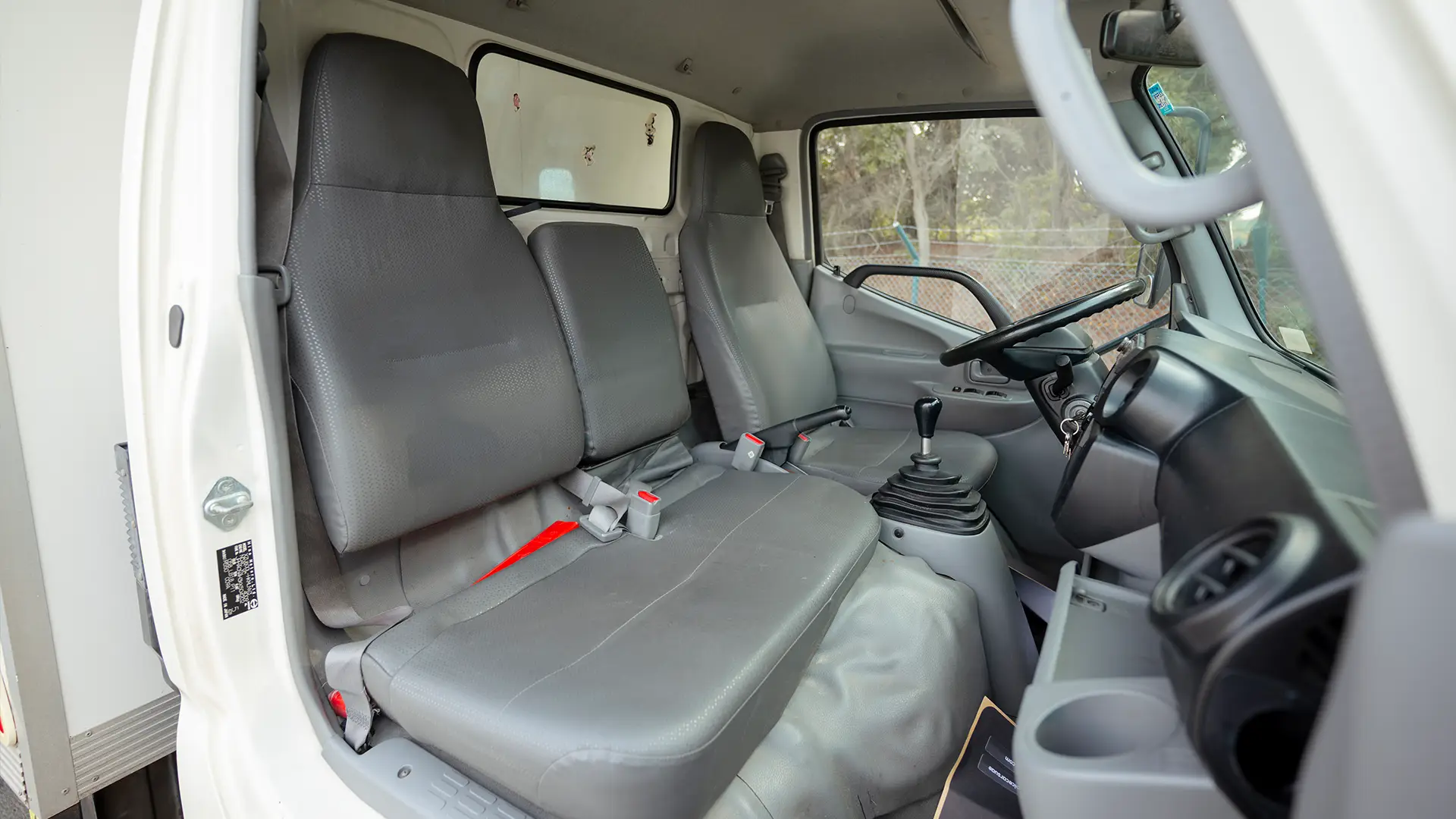 Used 2019 Hino 300 Dry Box in White – Front Passenger Side Cabin View for Sale at First Choice Cars Dubai Sharjah