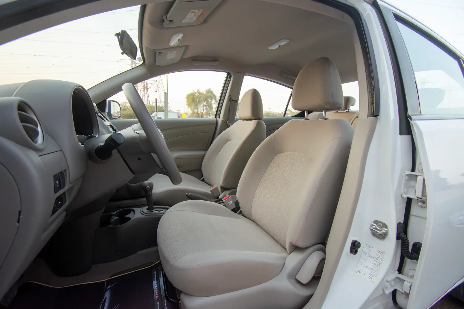 Used 2023 Nissan Sunny SV in White – Front Driver Side Cabin View for Sale at First Choice Cars Dubai Sharjah