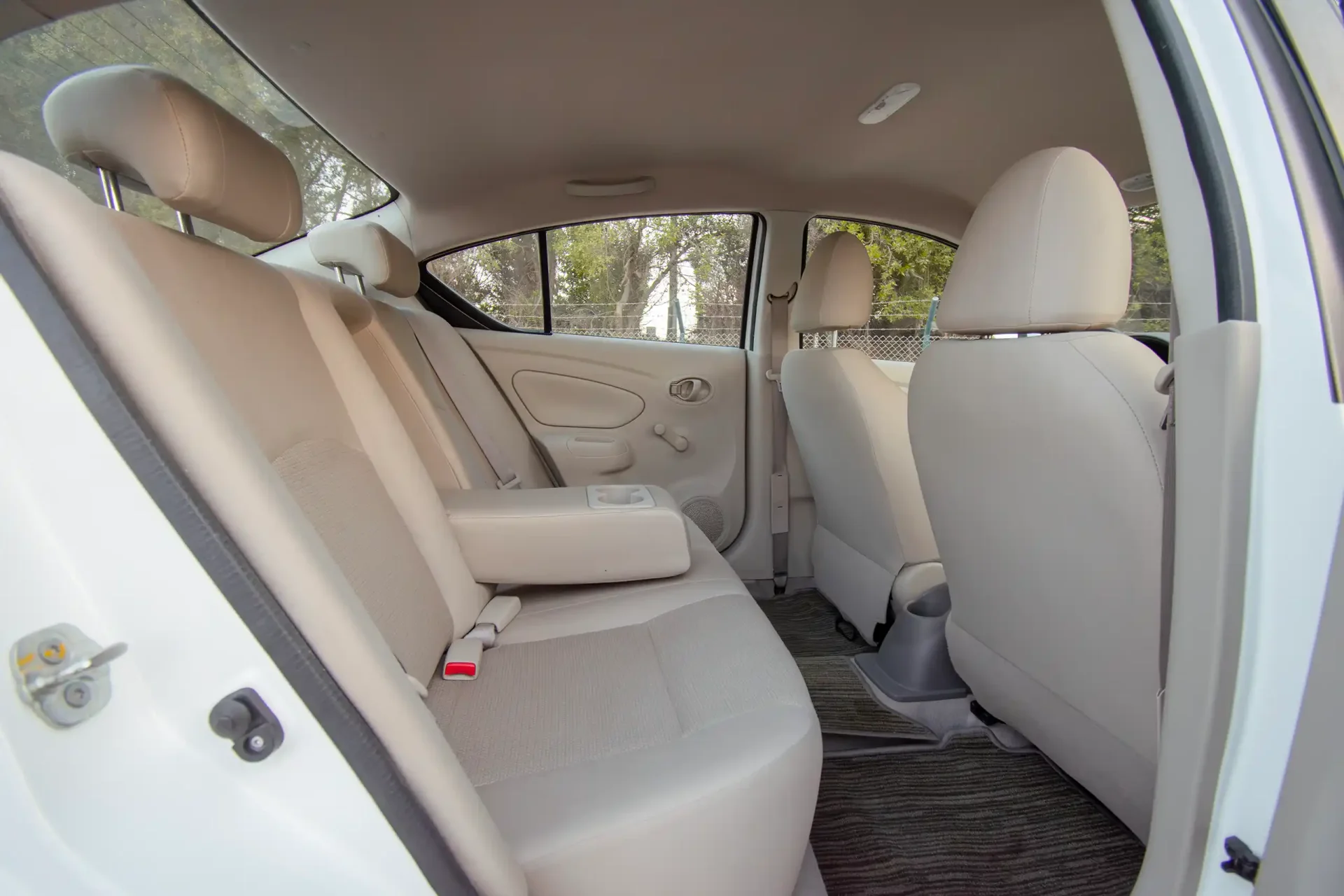 Used 2023 Nissan Sunny SV in White – Rear Passenger Side Cabin View for Sale at First Choice Cars Dubai Sharjah