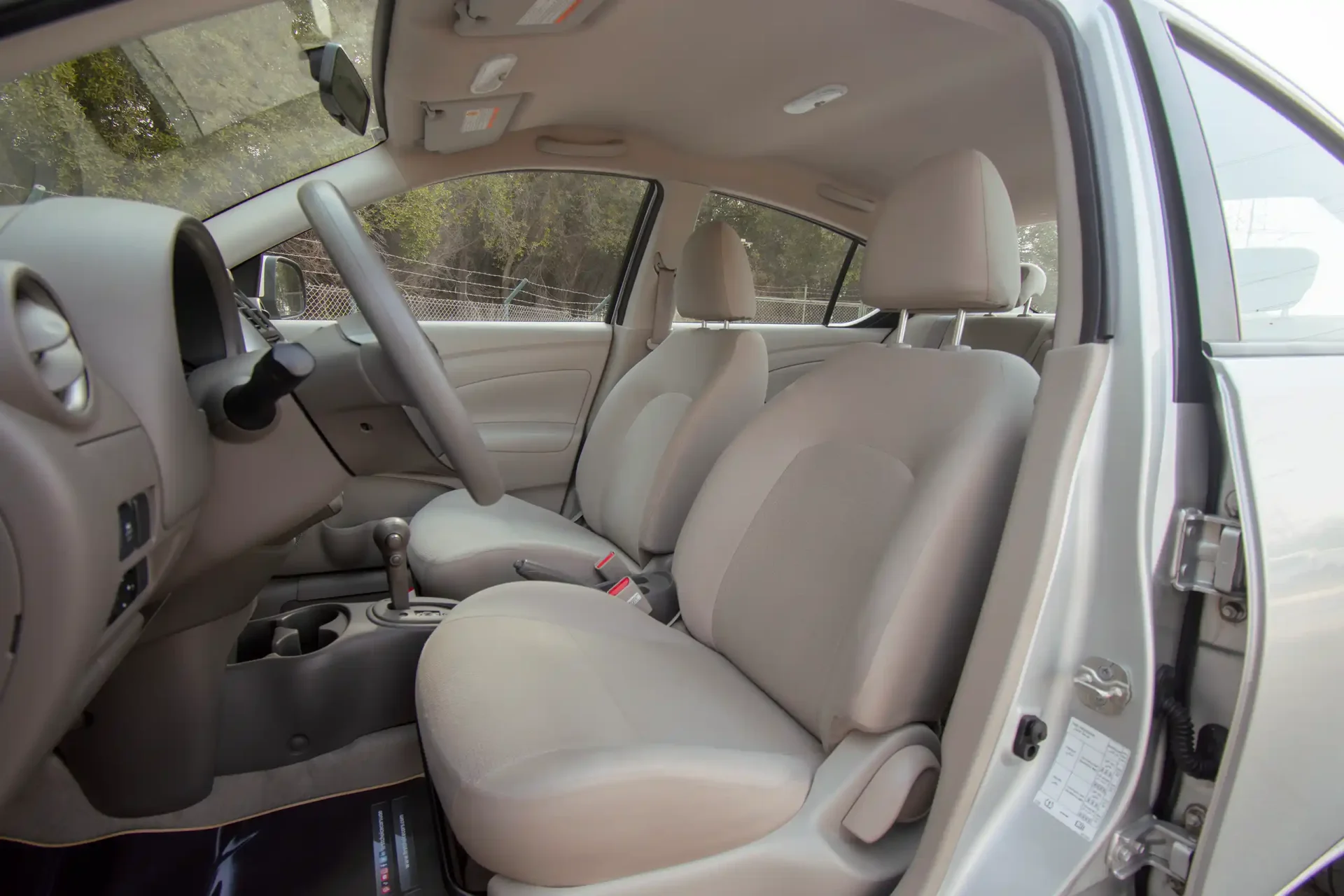 Used 2022 Nissan Sunny SV in Silver – Front Driver Side Cabin View for Sale at First Choice Cars Dubai Sharjah