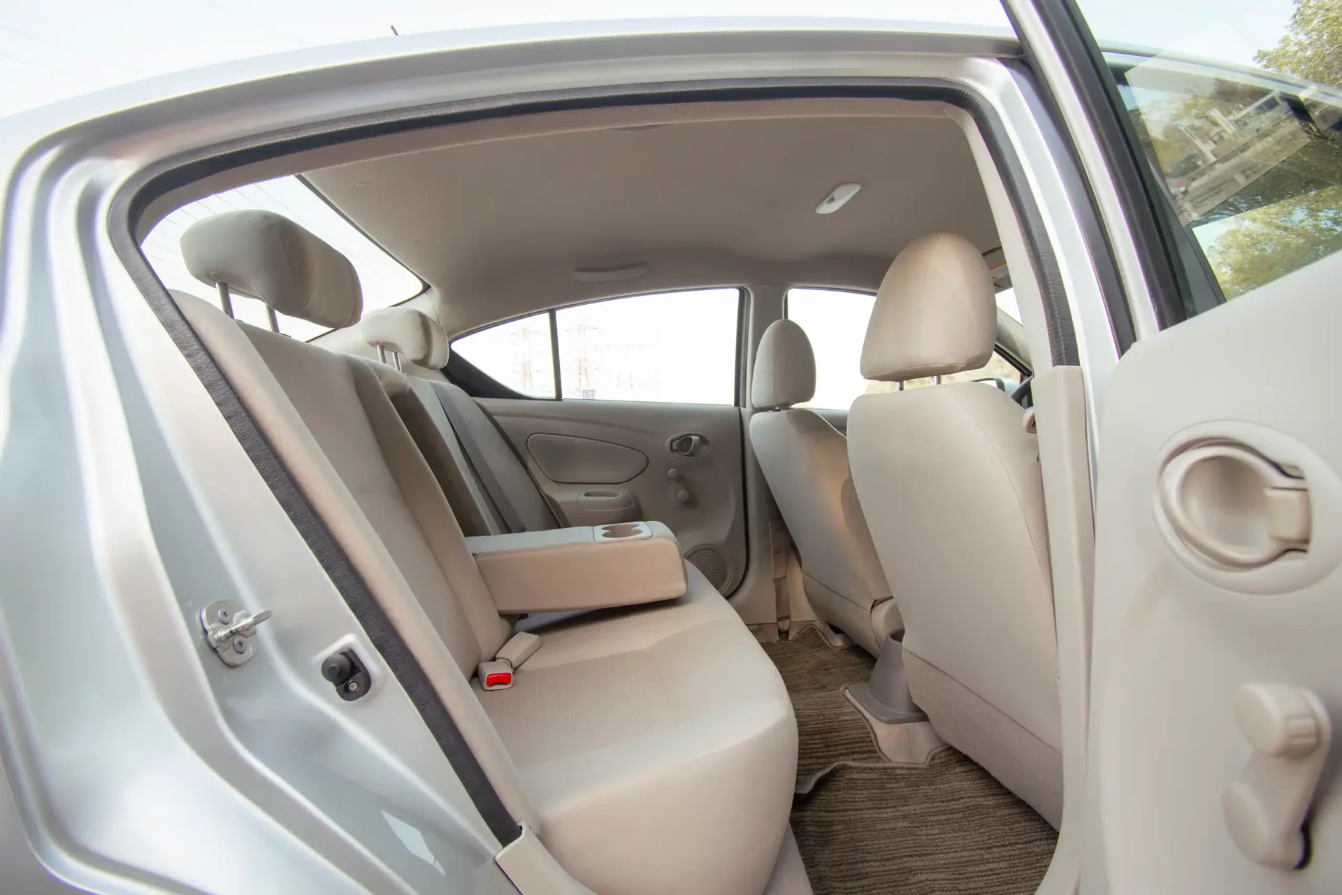Used 2022 Nissan Sunny SV in Silver – Rear Passenger Side Cabin View for Sale at First Choice Cars Dubai Sharjah
