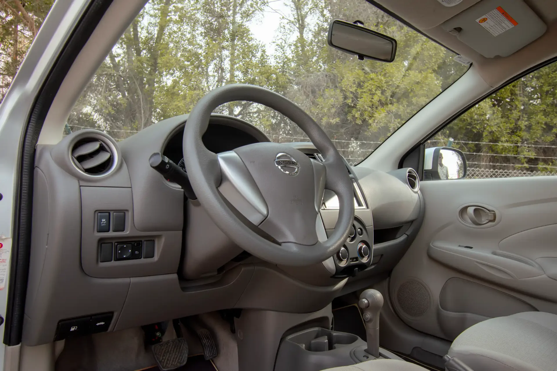 Used 2022 Nissan Sunny SV in Silver – Driver Side Dashboard & Steering View for Sale at First Choice Cars Dubai Sharjah