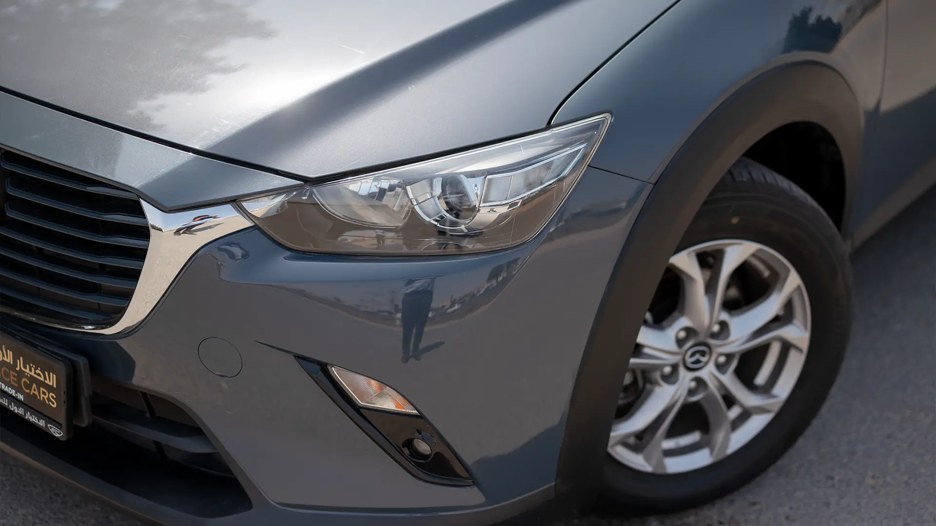 Used 2023 Mazda CX-3 GS in Grey – Headlight Close-up for Sale at First Choice Cars Dubai Sharjah