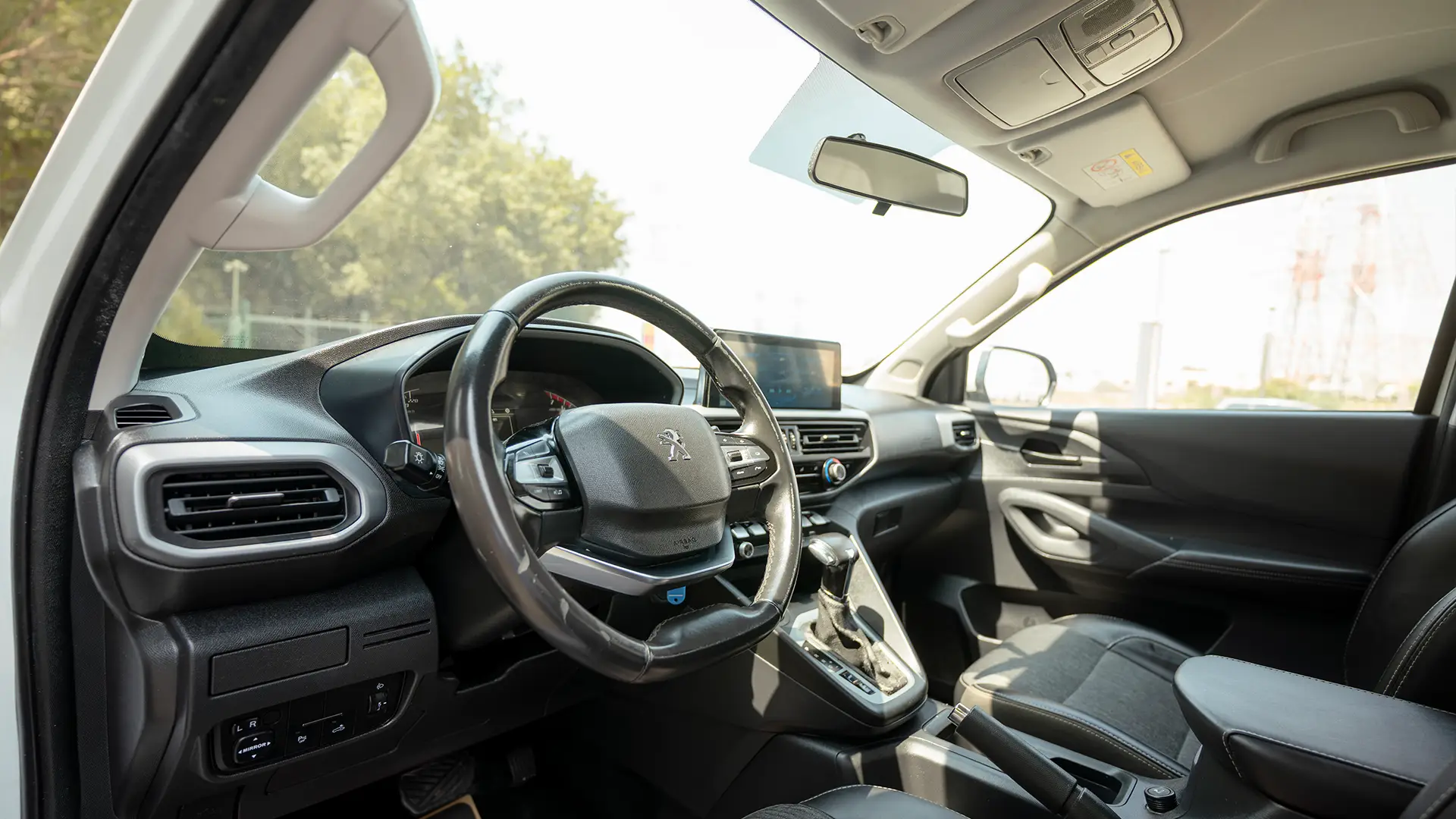 Used 2023 Peugeot Landtrek Double Cabin in White – Driver Side Dashboard & Steering View for Sale at First Choice Cars Dubai Sharjah