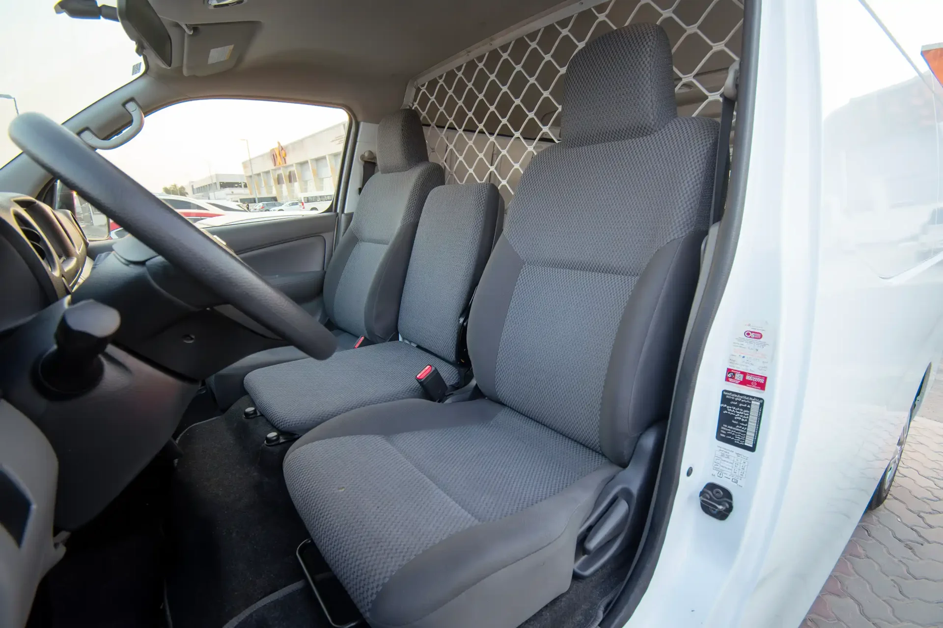 Used 2022 Nissan Urvan Standard Roof in White – Front Driver Side Cabin View for Sale at First Choice Cars Dubai Sharjah