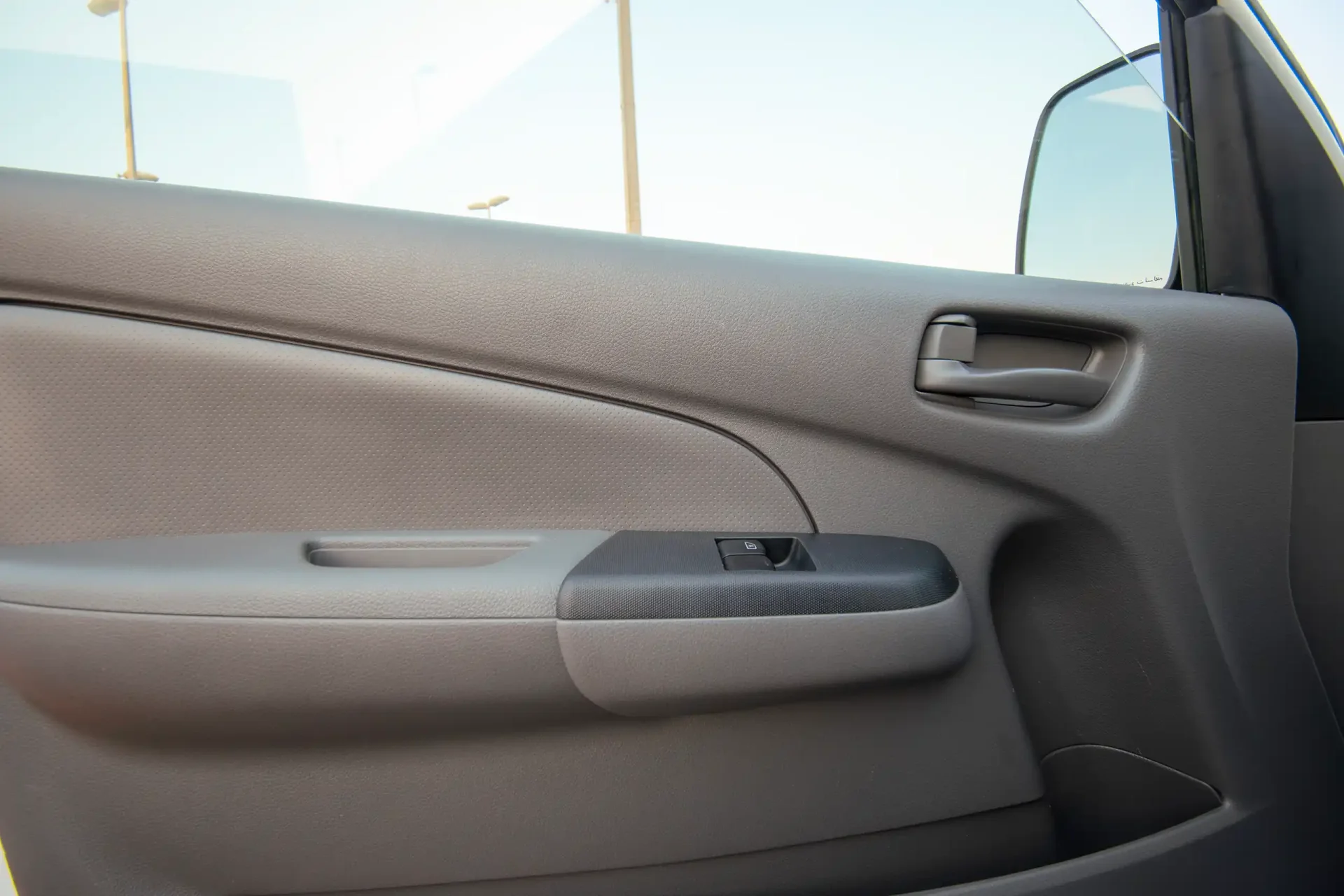 Used 2022 Nissan Urvan Standard Roof in White – Driver Door Panel Full View for Sale at First Choice Cars Dubai Sharjah
