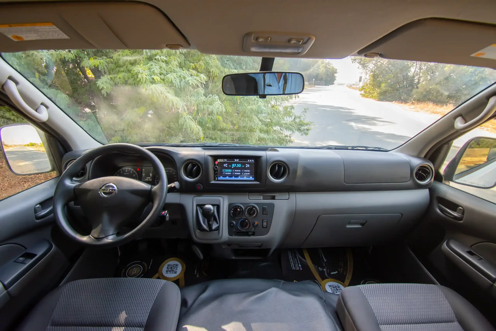 Used 2021 Nissan Urvan High Roof in White – Front Cabin / Dashboard Full View for Sale at First Choice Cars Dubai Sharjah