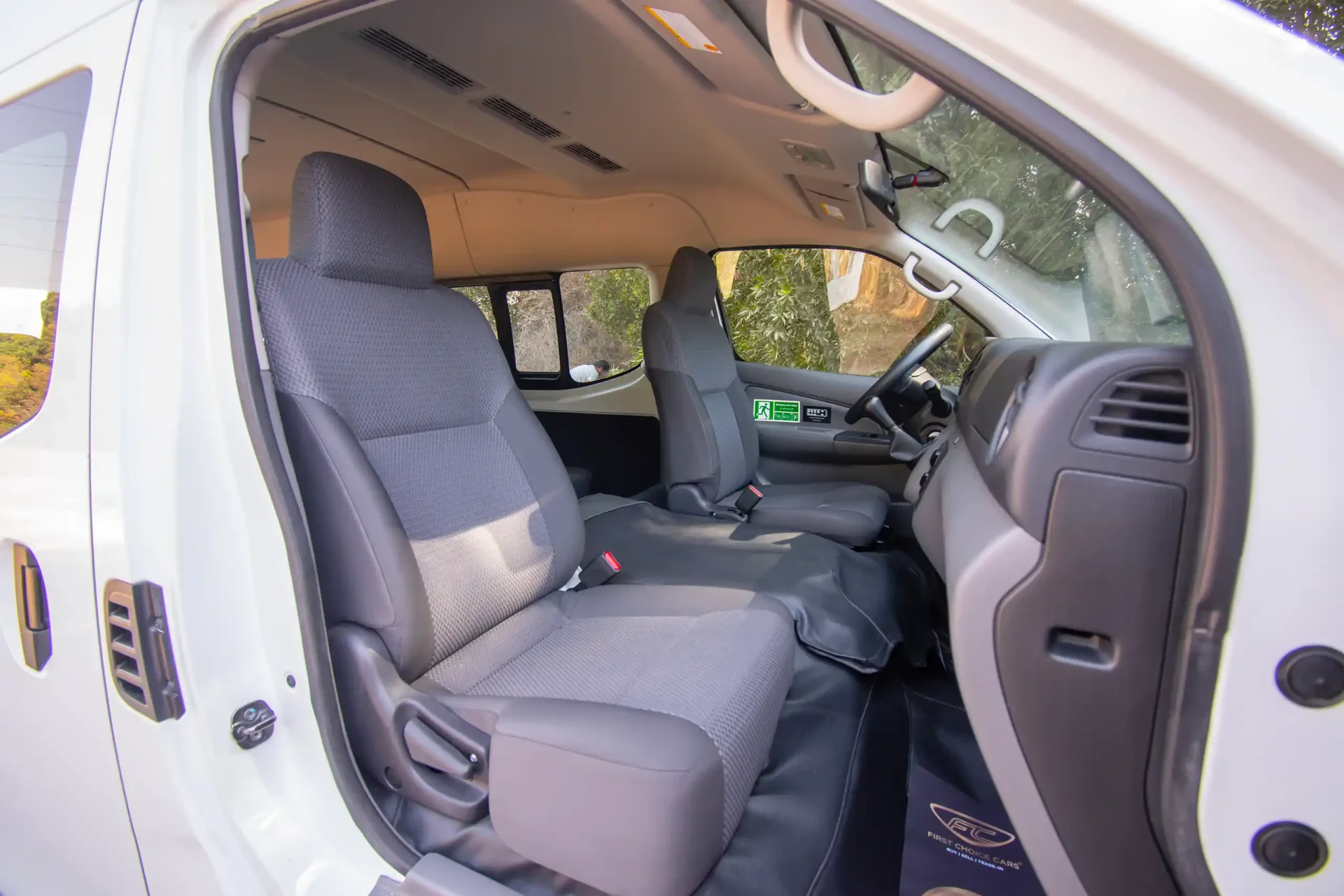 Used 2021 Nissan Urvan High Roof in White – Front Passenger Side Cabin View for Sale at First Choice Cars Dubai Sharjah