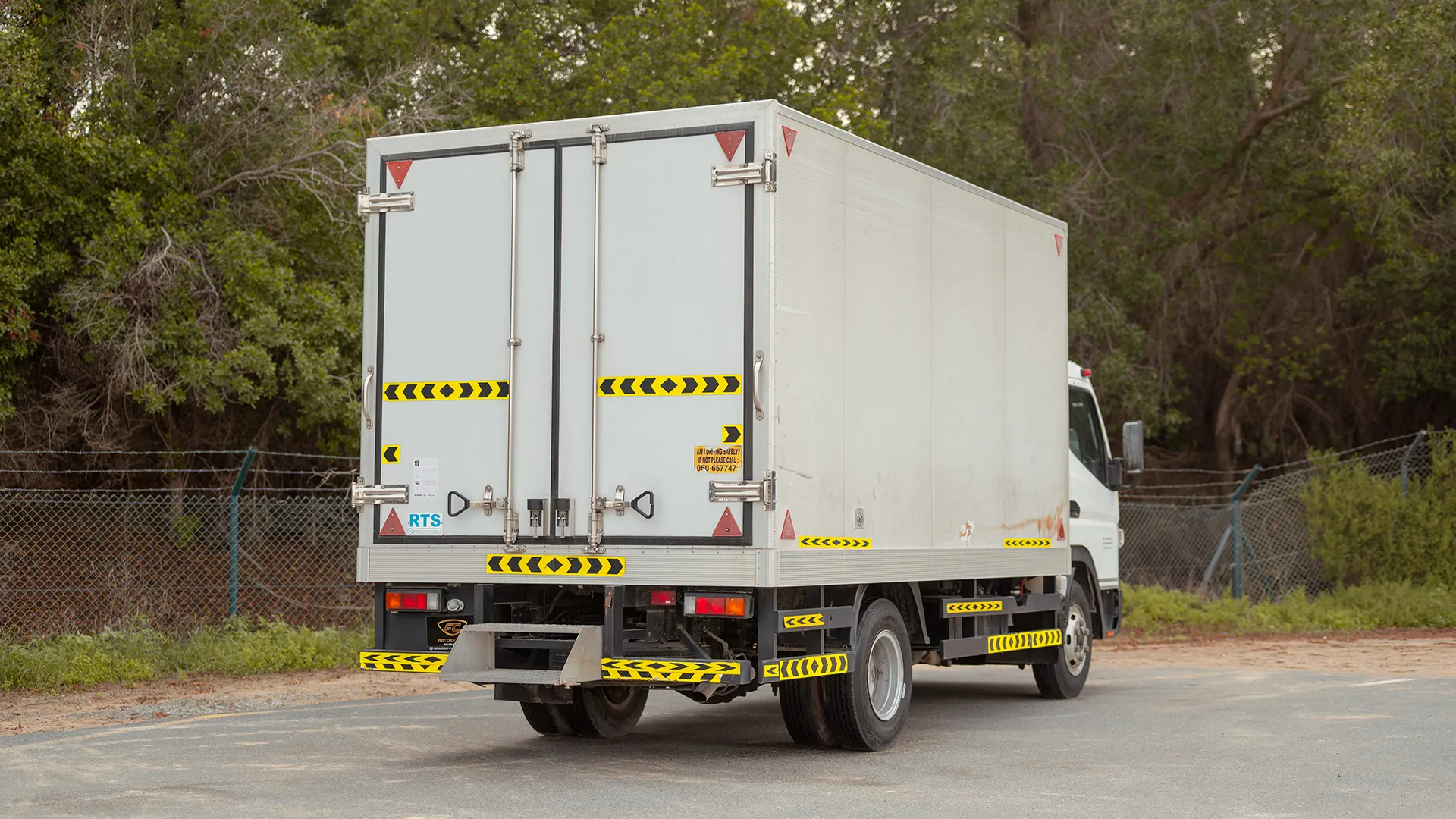 Used 2020 Mitsubishi Canter Chiller Box in White – Right Back Diagonal (45°) View for Sale at First Choice Cars Dubai Sharjah