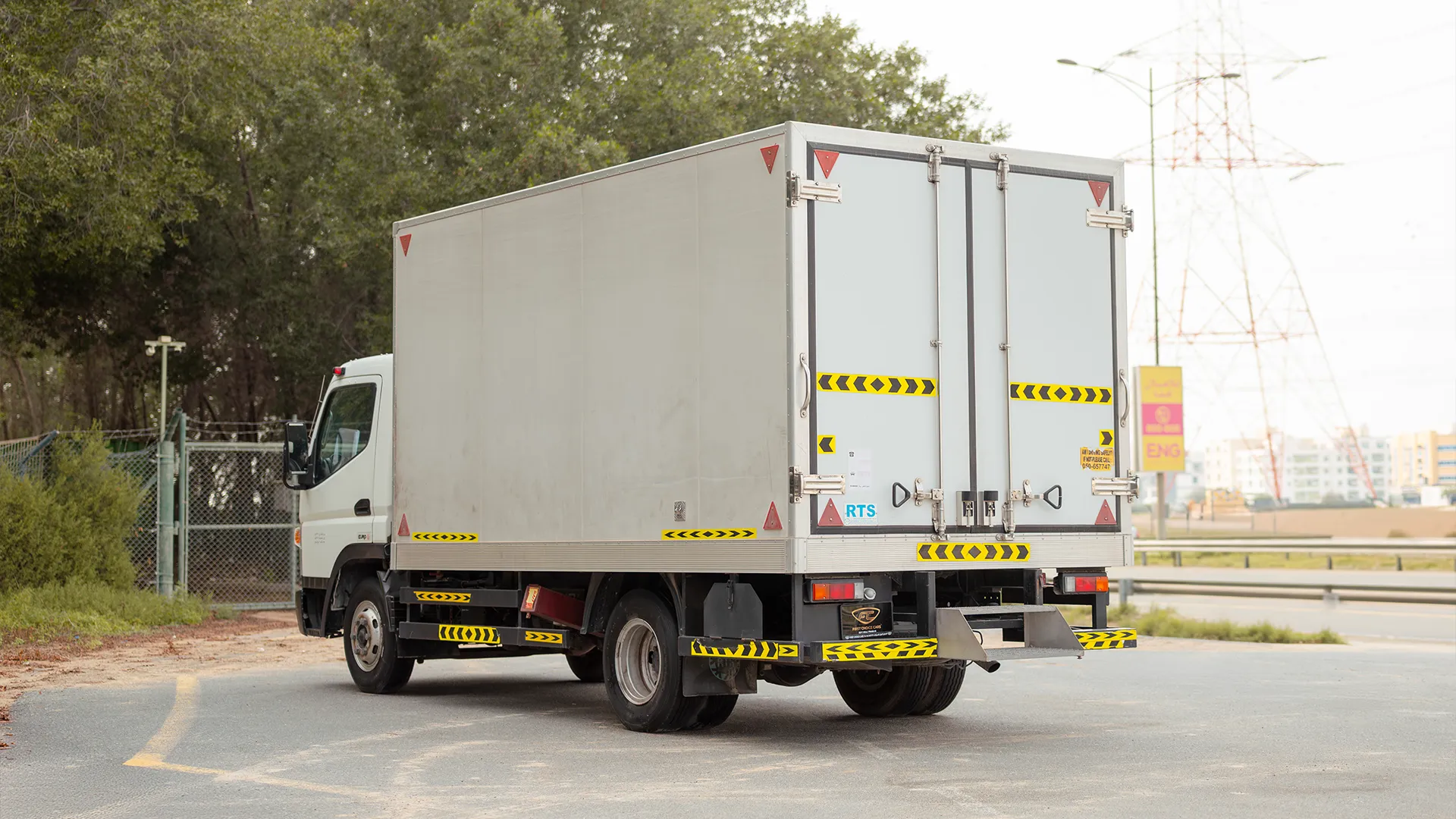 Used 2020 Mitsubishi Canter Chiller Box in White – Left Back Diagonal (45°) View for Sale at First Choice Cars Dubai Sharjah