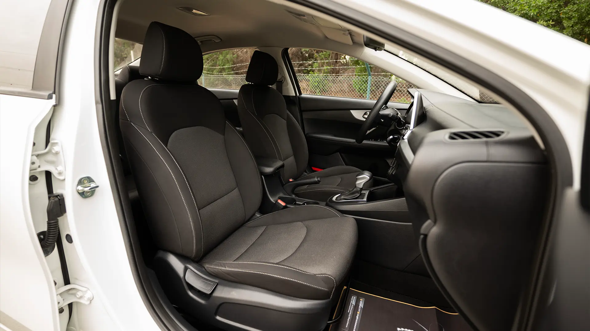 Used 2023 Kia Cerato LX in White – Front Passenger Side Cabin View for Sale at First Choice Cars Dubai Sharjah