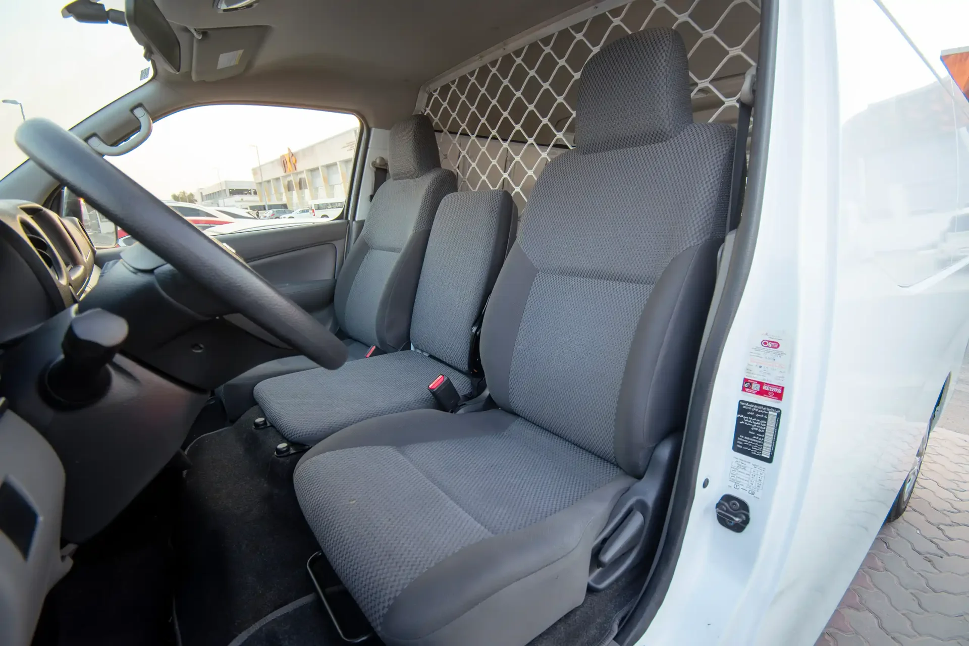 Used 2022 Nissan Urvan Standard Roof in White – Front Driver Side Cabin View for Sale at First Choice Cars Dubai Sharjah