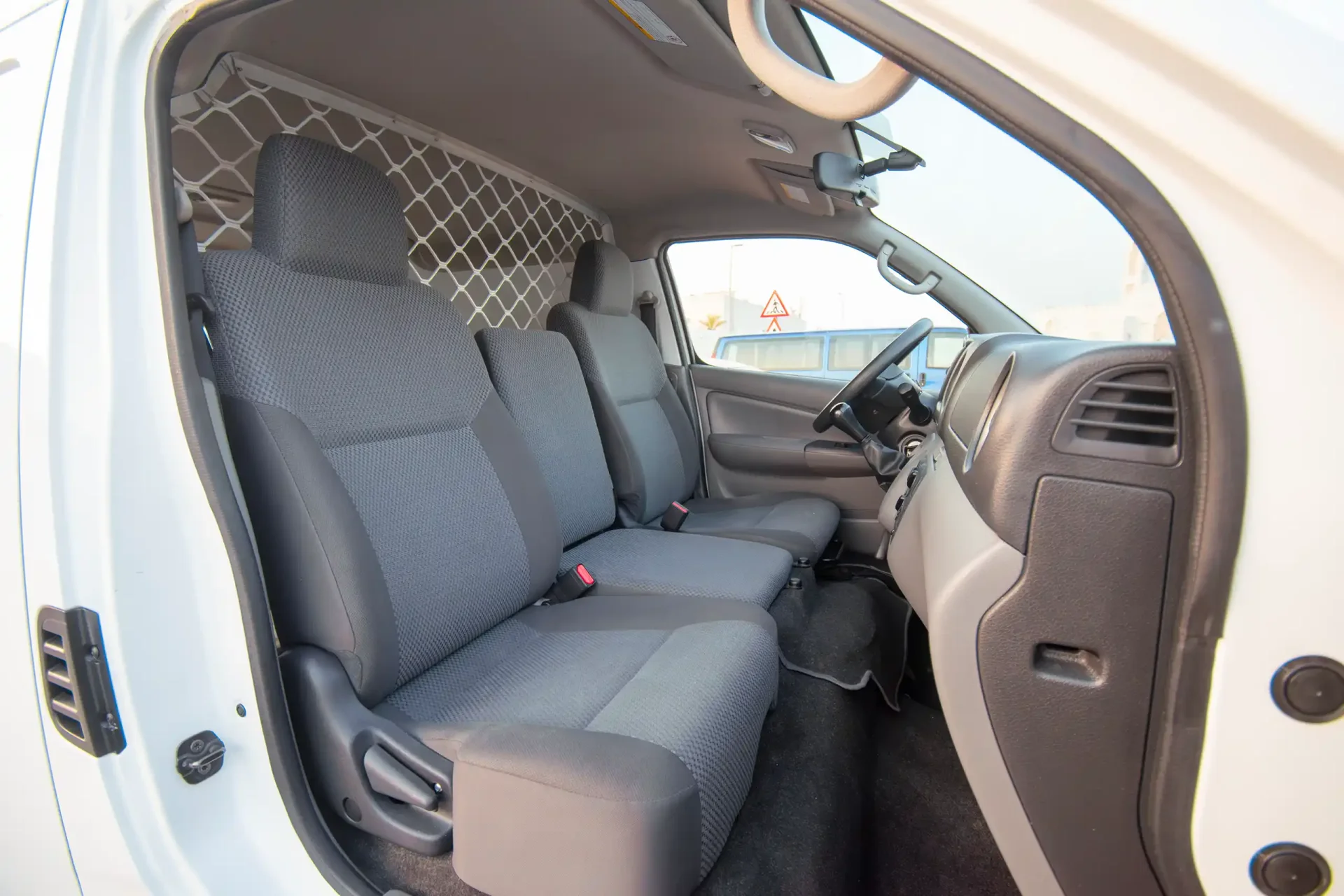 Used 2022 Nissan Urvan Standard Roof in White – Front Passenger Side Cabin View for Sale at First Choice Cars Dubai Sharjah