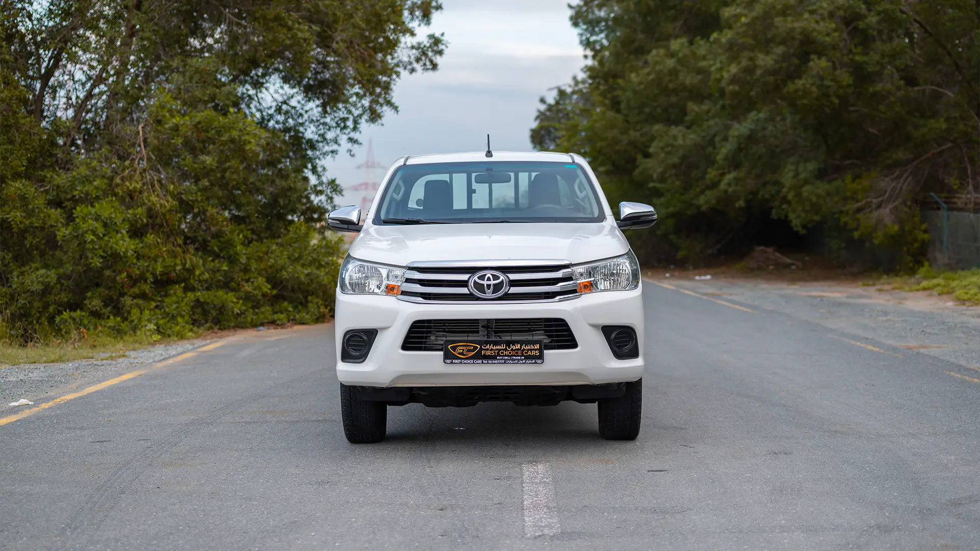 Used 2021 Toyota Hilux DLX Double Cabin in White – Front View for Sale at First Choice Cars Dubai Sharjah