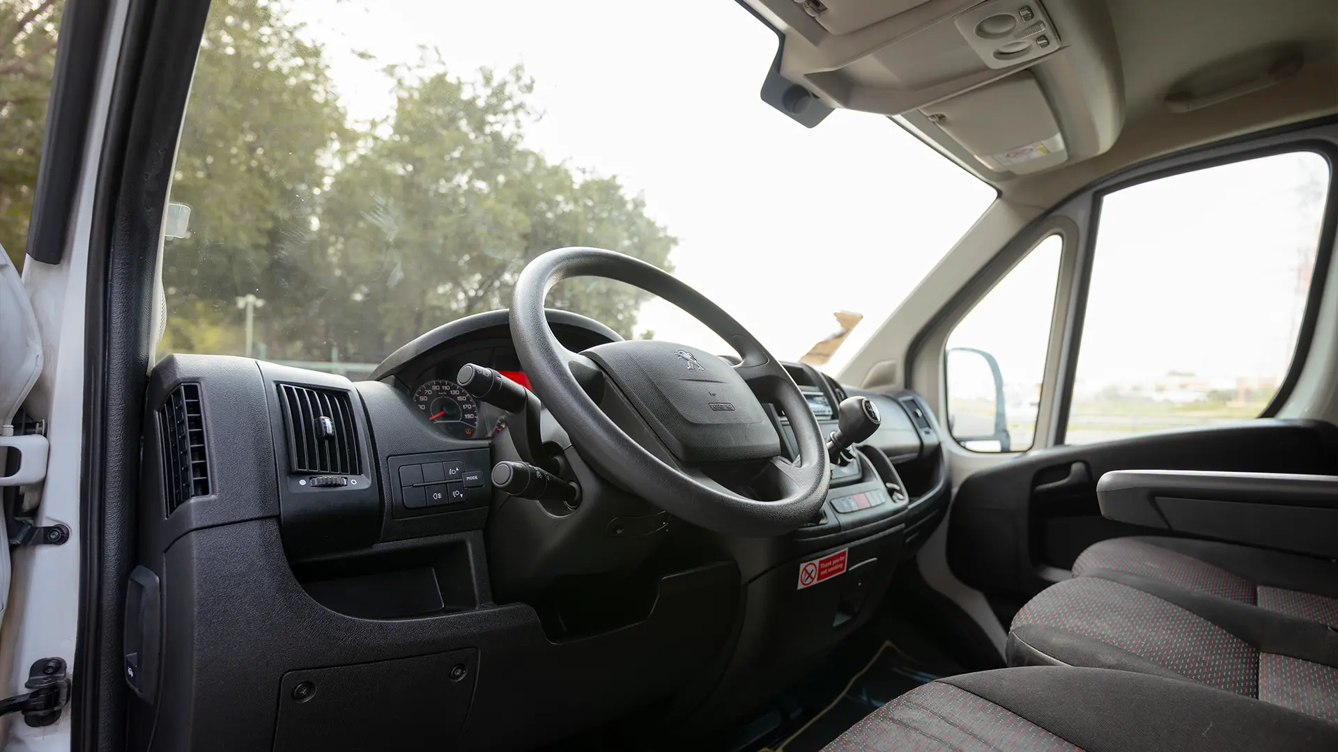Used 2022 Peugeot Boxer L2h2 in White – Driver Side Dashboard & Steering View for Sale at First Choice Cars Dubai Sharjah