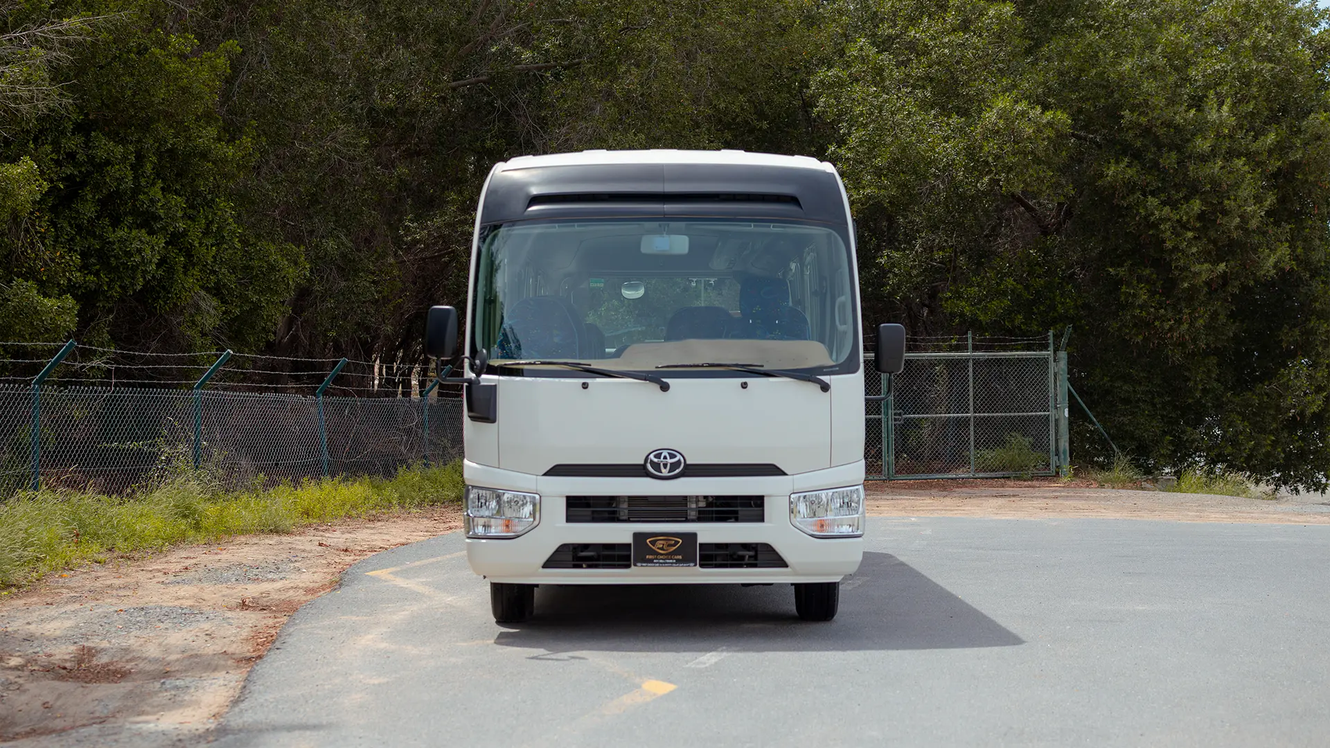 Used 2022 Toyota Coaster High Roof in White – Front View for Sale at First Choice Cars Dubai Sharjah