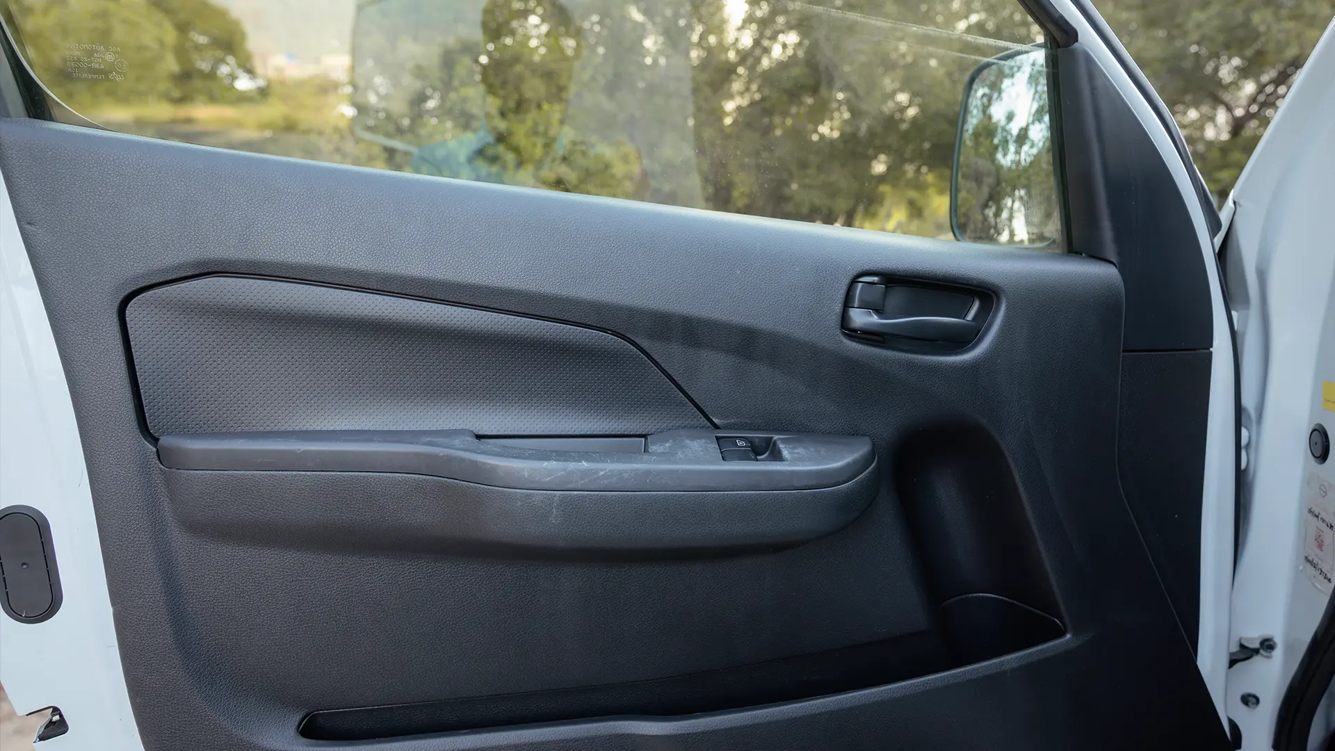 Used 2023 Nissan Urvan High Roof in White – Driver Door Panel Full View for Sale at First Choice Cars Dubai Sharjah