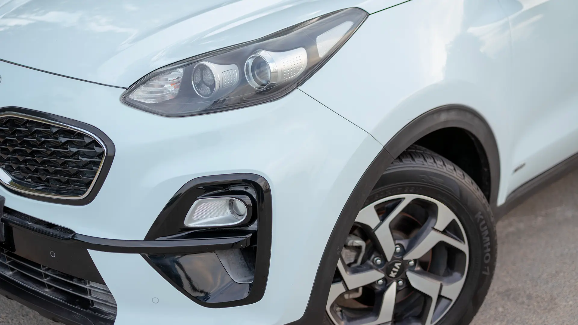 Used 2020 Kia Sportage LX in White – Headlight Close-up for Sale at First Choice Cars Dubai Sharjah